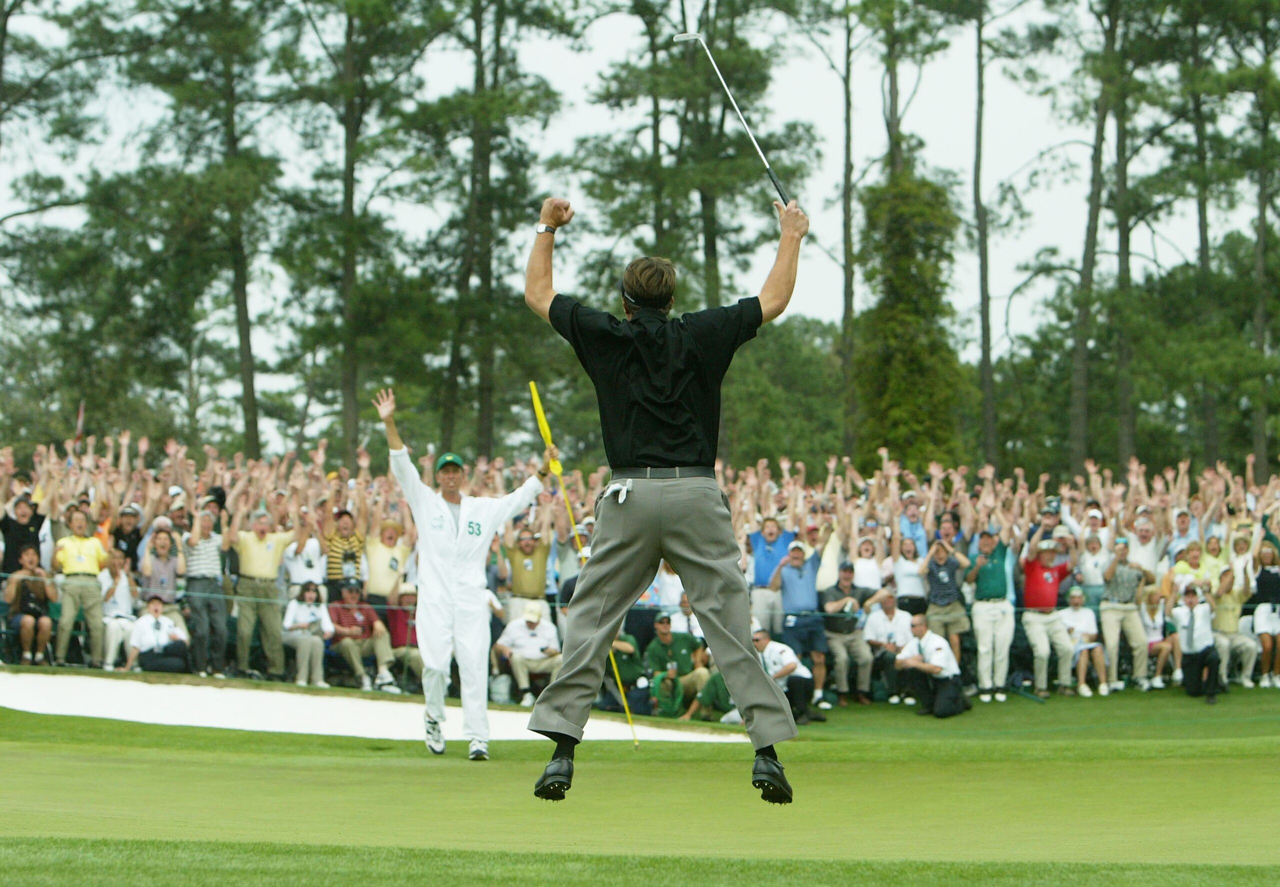 AUGUSTA, GA - APRIL 11:  Phil Mickelson jumps in the air after making birdie on the 18th hole to win the Masters by one shot during the final round of the Masters at the Augusta National Golf Club on April 11, 2004 in Augusta, Georgia.  (Photo by Andrew R