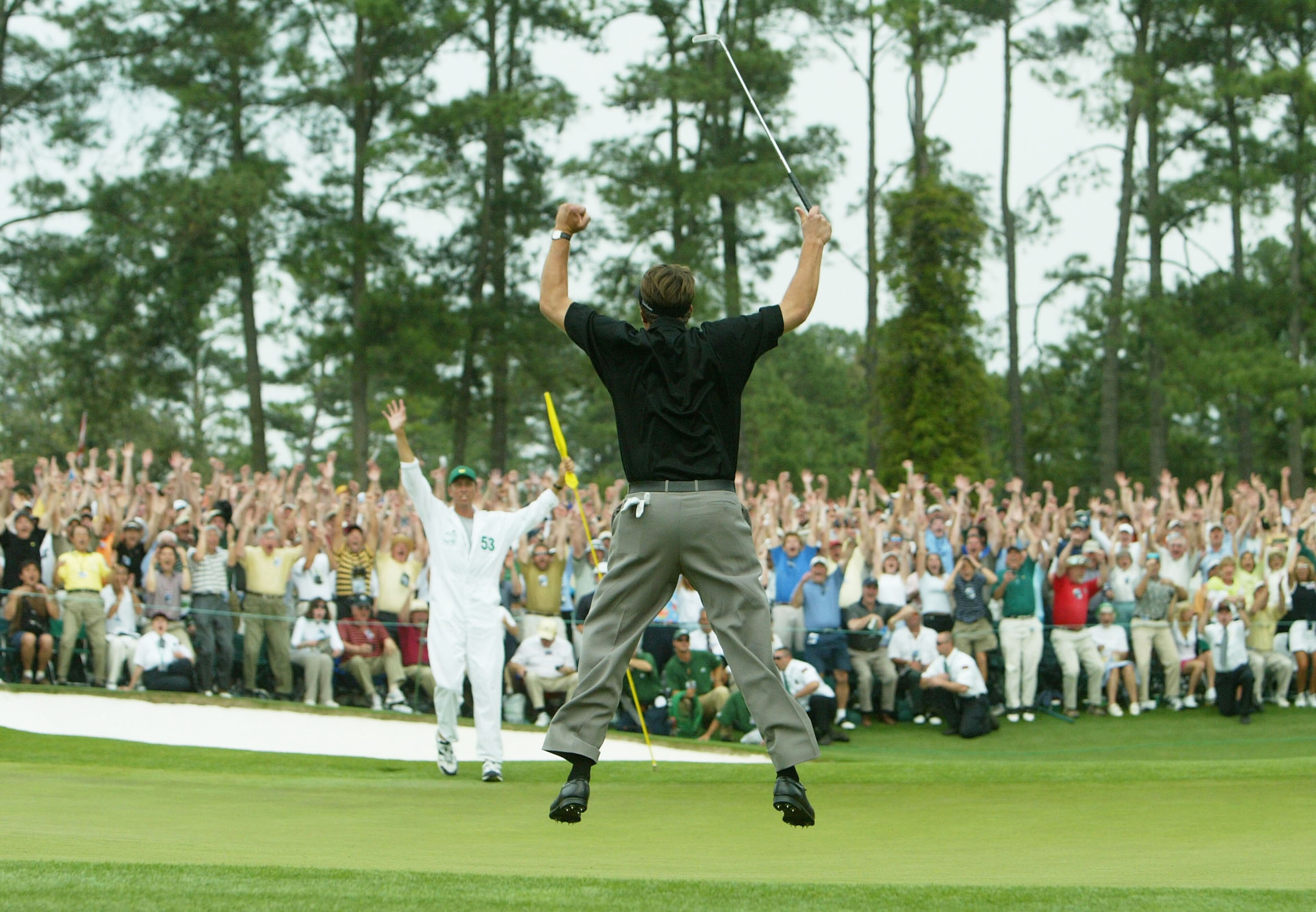 AUGUSTA, GA - APRIL 11:  Phil Mickelson jumps in the air after making birdie on the 18th hole to win the Masters by one shot during the final round of the Masters at the Augusta National Golf Club on April 11, 2004 in Augusta, Georgia.  (Photo by Andrew R