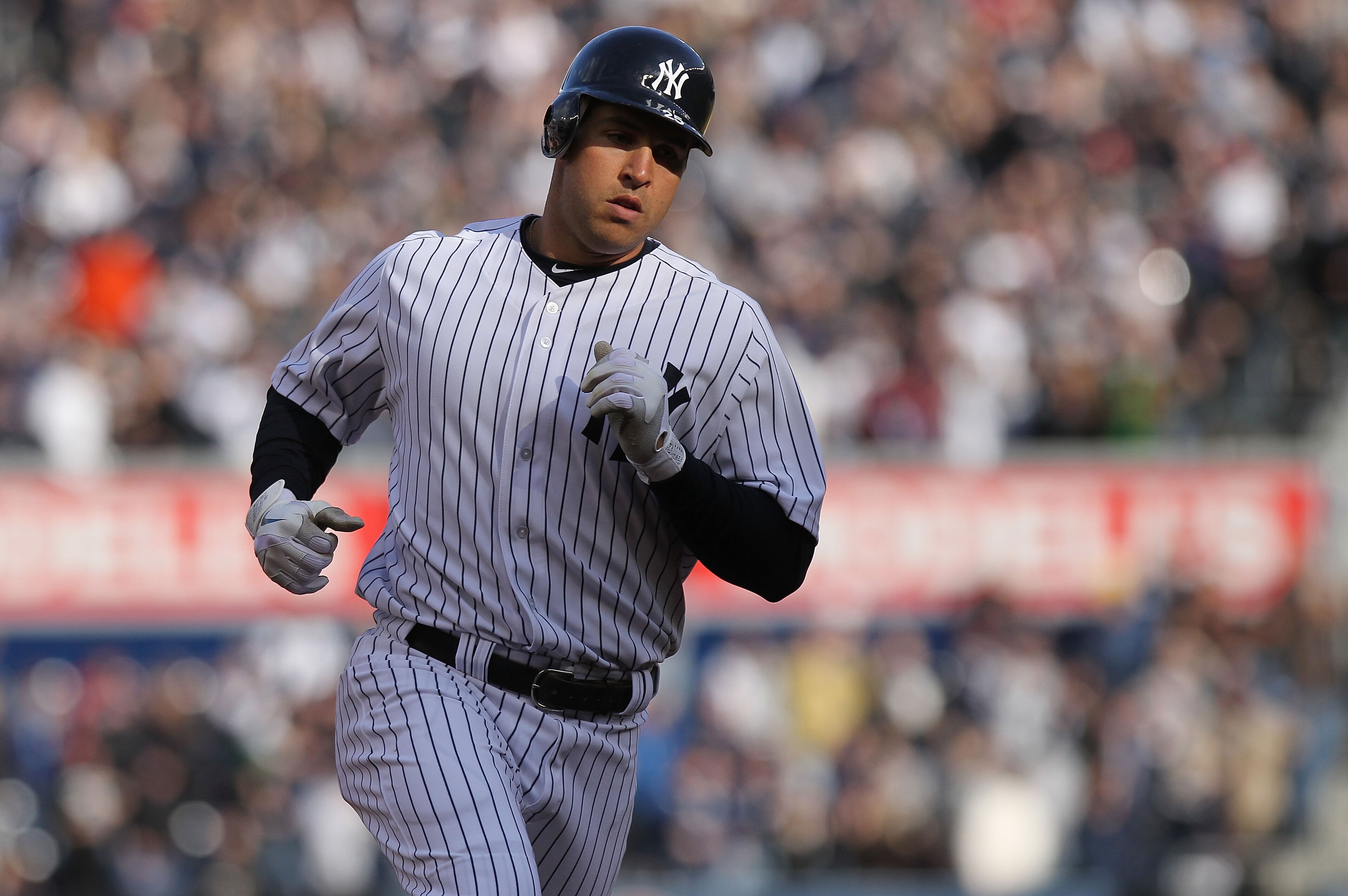 NEW YORK, NY - APRIL 02:  Mark Teixeira #25 of the New York Yankees rounds the bases after hitting a 3 RBI home run against the Detroit Tigers at Yankee Stadium on April 2, 2011 in the Bronx borough of New York City.  (Photo by Nick Laham/Getty Images)