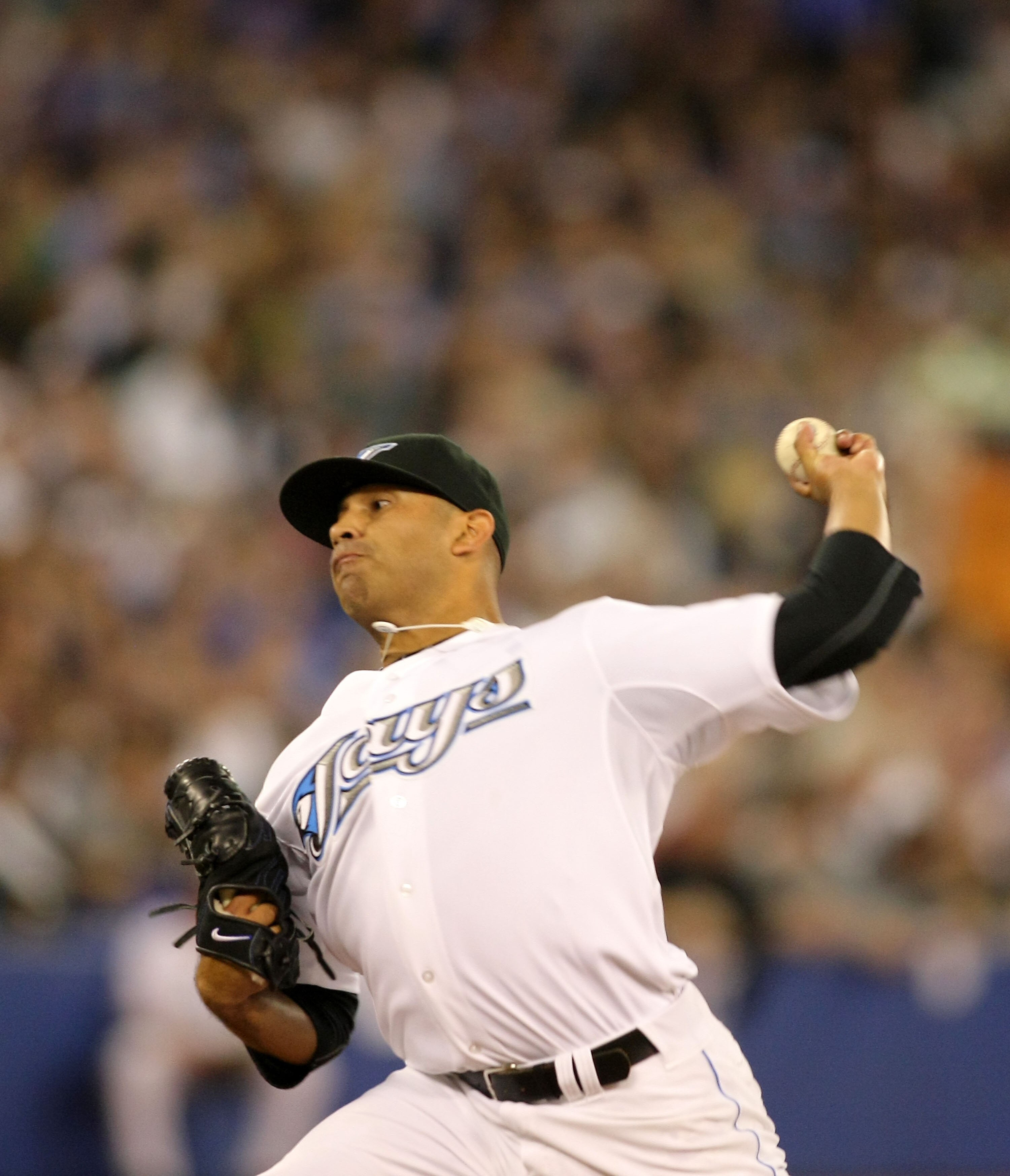 TORONTO,CANADA - APRIL 1:  Ricky Romero #24 of the Toronto Blue Jays throws a pitch against the Minnesota Twins on opening day during their MLB game at the Rogers Centre April 1, 2011 in Toronto, Ontario, Canada.(Photo By Dave Sandford/Getty Images)
