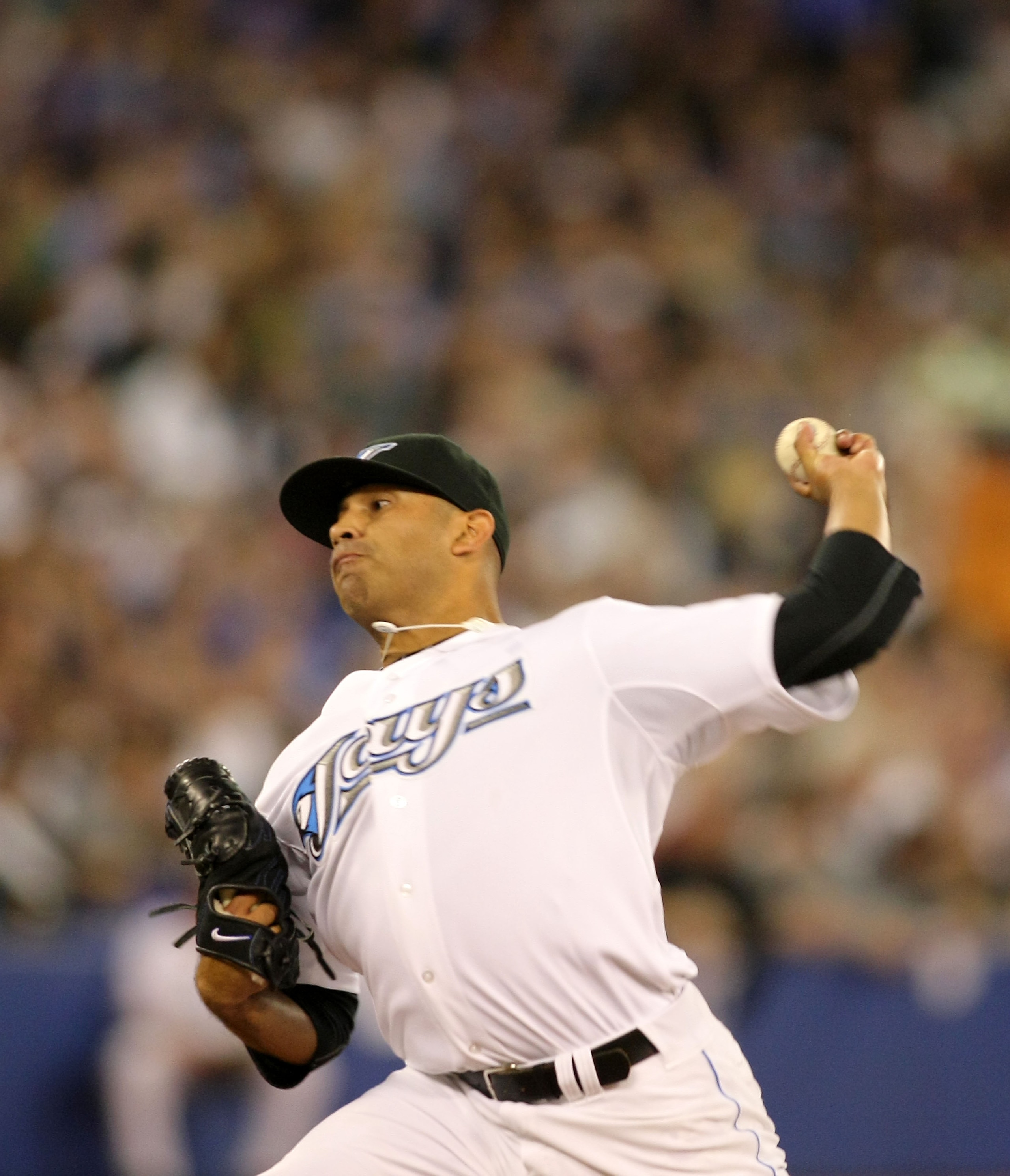 TORONTO,CANADA - APRIL 1:  Ricky Romero #24 of the Toronto Blue Jays throws a pitch against the Minnesota Twins on opening day during their MLB game at the Rogers Centre April 1, 2011 in Toronto, Ontario, Canada.(Photo By Dave Sandford/Getty Images)
