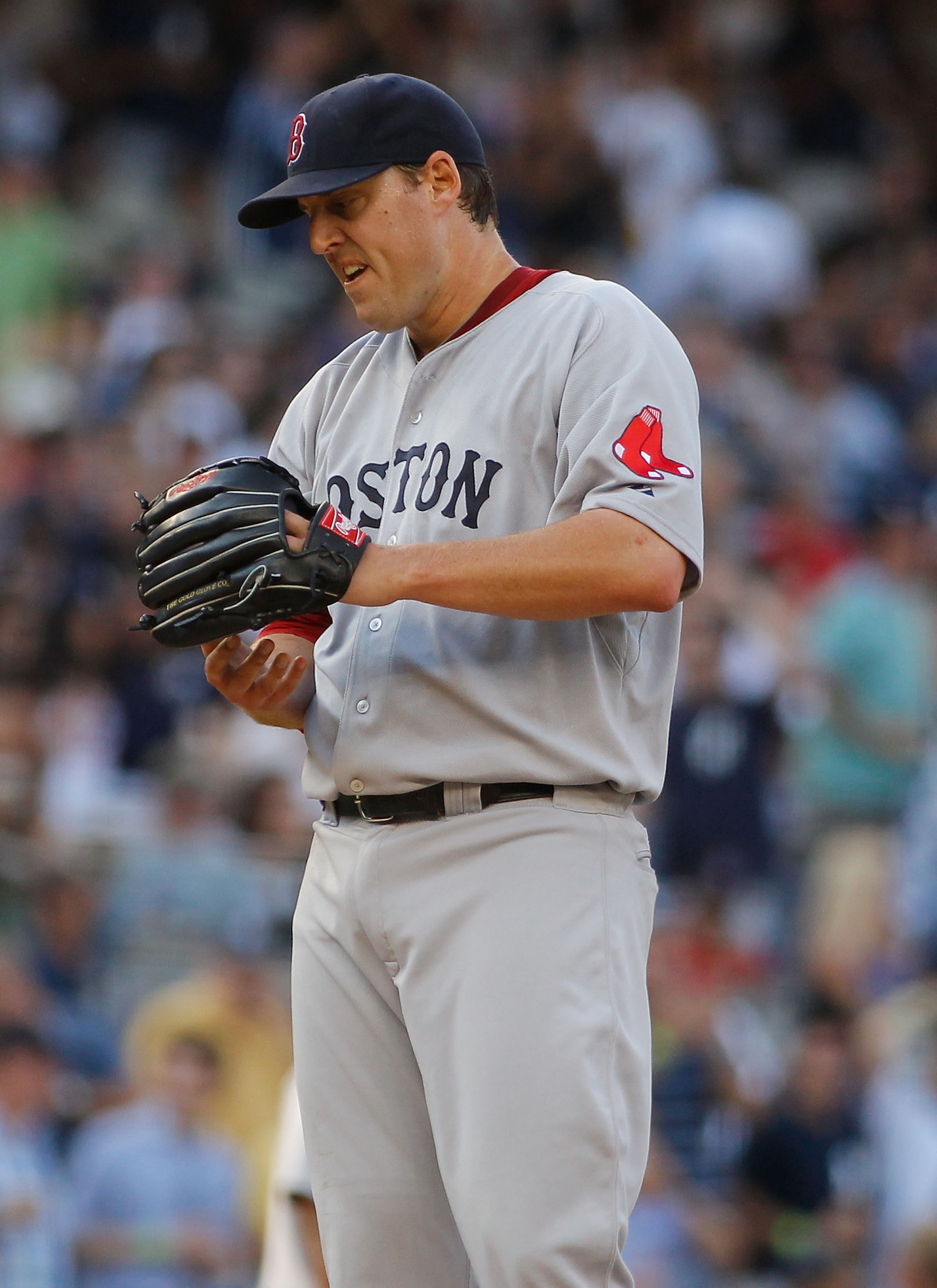NEW YORK - AUGUST 07:  John Lackey #40 of the Boston Red Sox reacts against the New York Yankees on August 7, 2010 at Yankee Stadium in the Bronx borough of New York City.  (Photo by Mike Stobe/Getty Images)