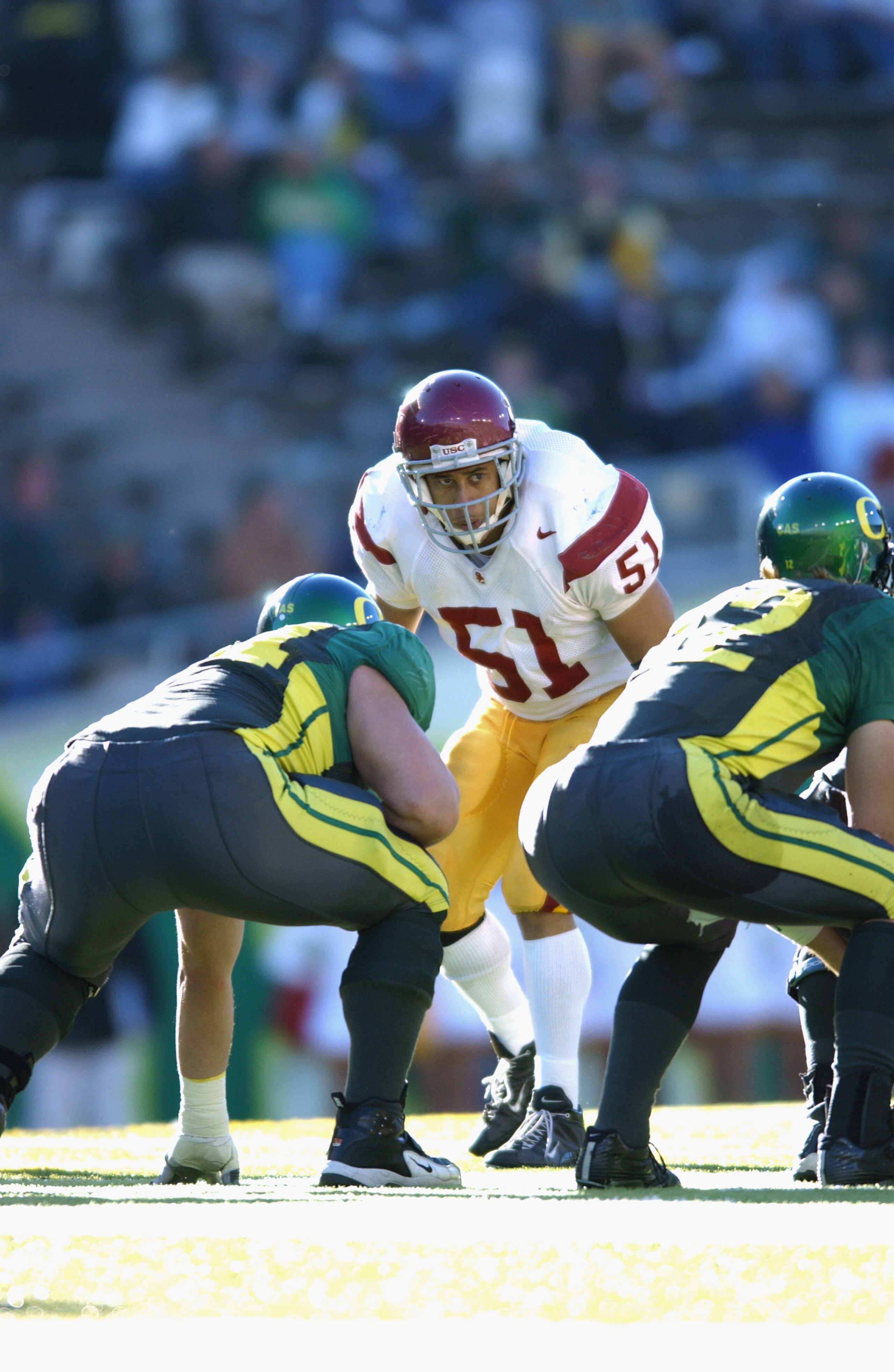 EUGENE - OCTOBER 26:  Linebacker Melvin Simmons #51 of the USC Trojans prepares for the play during the game against the Oregon Ducks at Autzen Stadium on October 26, 2002 in Eugene, Oregon. USC defeated Oregon 44-33.  (Photo by Otto Greule Jr/Getty Image