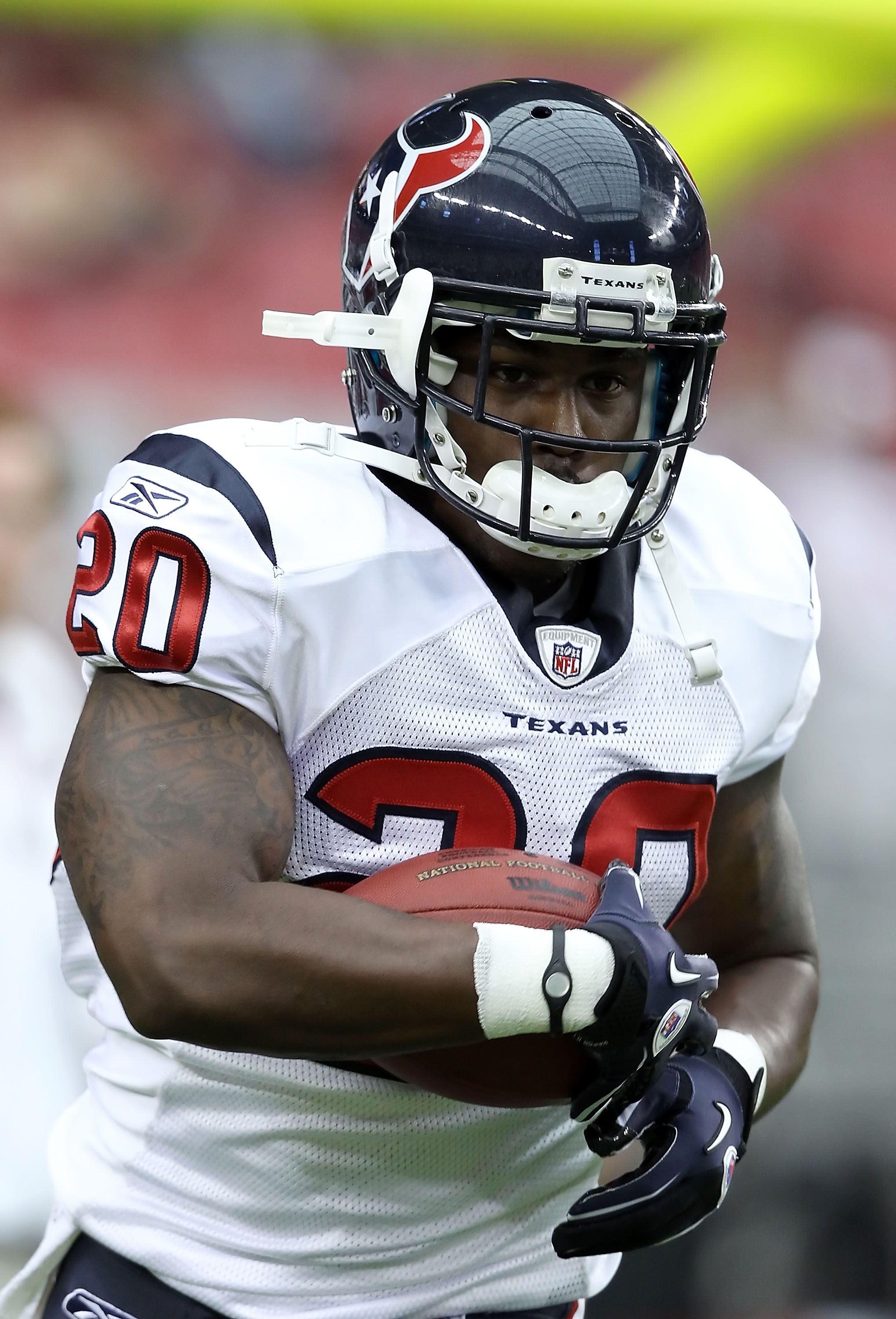 GLENDALE, AZ - AUGUST 14:  Runningback Steve Slaton #20 of the Houston Texans carries the ball during warm ups to the preseason NFL game against the Arizona Cardinals at the University of Phoenix Stadium on August 14, 2010 in Glendale, Arizona.  The Cardi