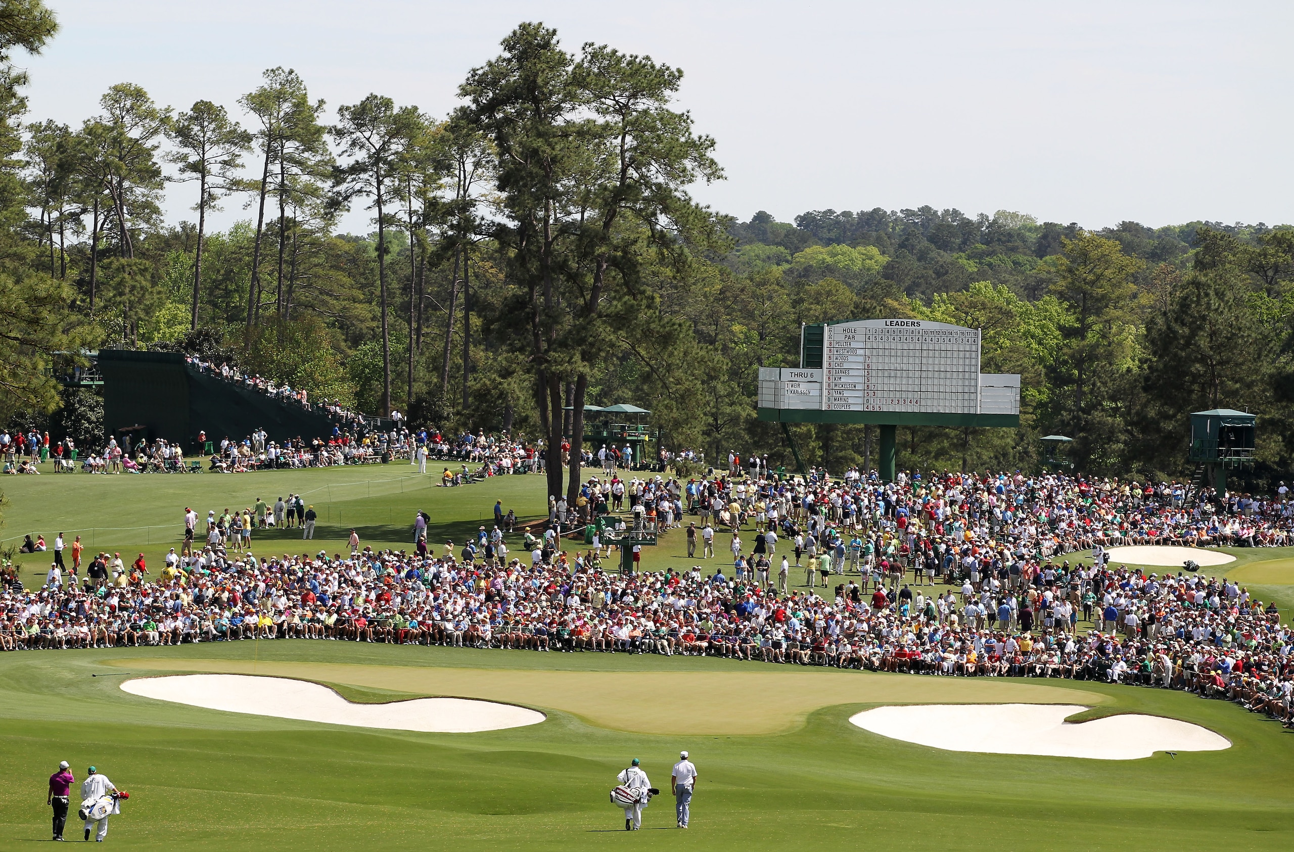 AUGUSTA, GA - APRIL 10:  The group of Anthony Kim (L) and Ricky Barnes (R) walk with their caddies to the second green during the third round of the 2010 Masters Tournament at Augusta National Golf Club on April 10, 2010 in Augusta, Georgia.  (Photo by Ja