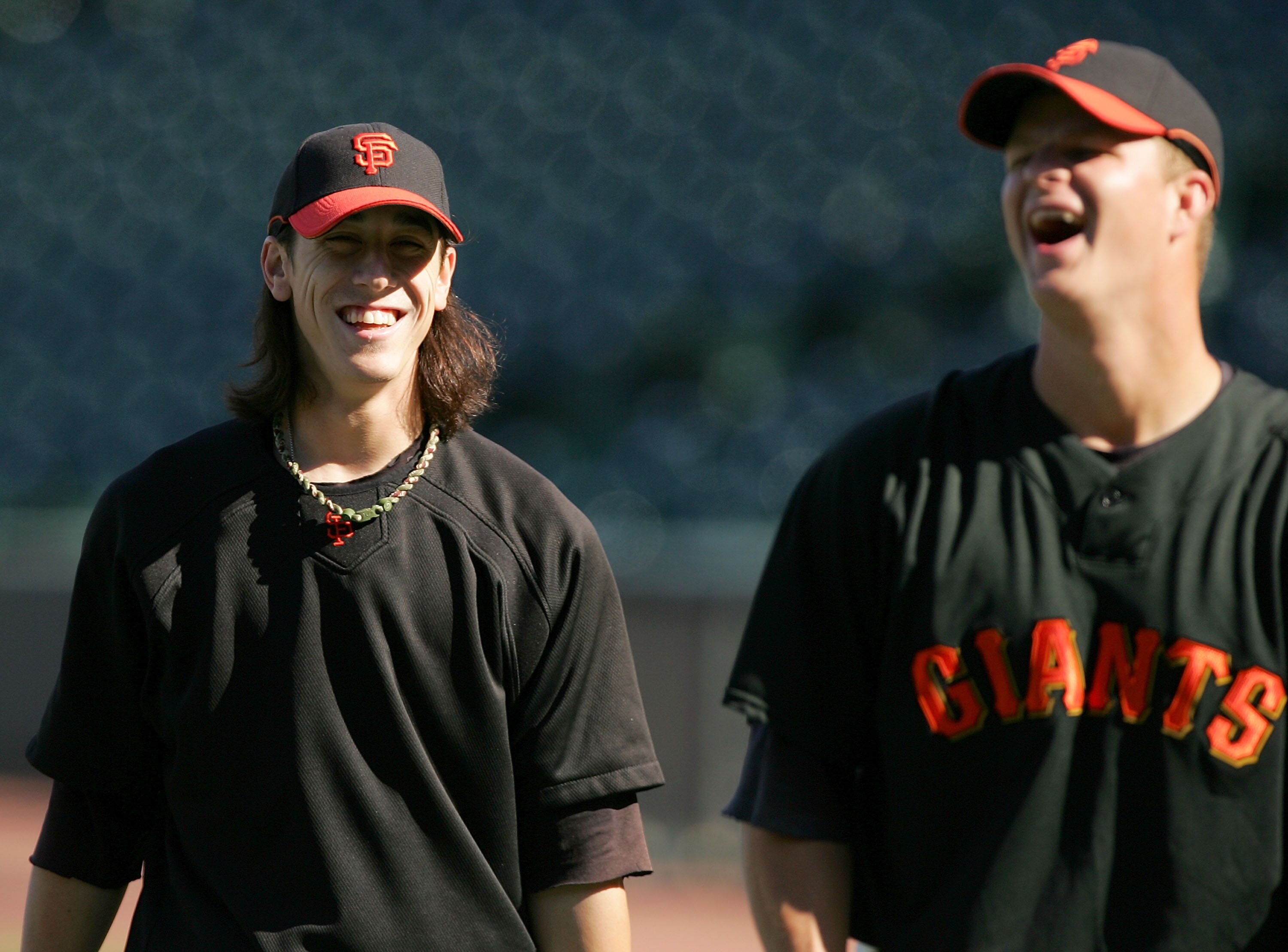 SAN FRANCISCO - AUGUST 26:  Tim Lincecum #55 of the San Francisco Giants jokes with Matt Cain #18 during batting practice before their game against the Arizona Diamondbacks at AT&T Park on August 26, 2009 in San Francisco, California.  (Photo by Ezra Shaw