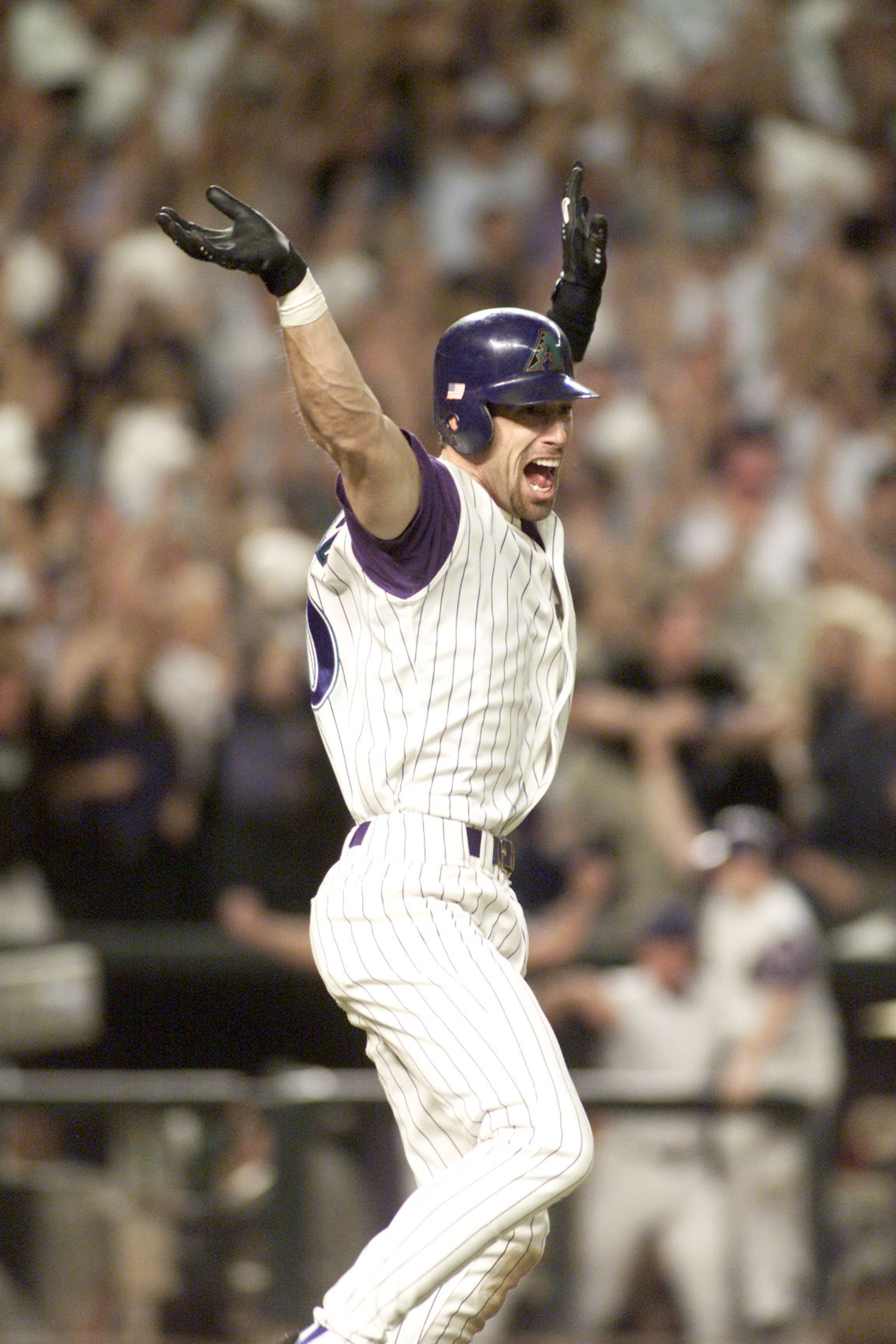 4 Nov 2001: Luis Gonzalez #20 of the Arizona Diamondbacks celebrates on his way to first base after scoring the winning run against the New York Yankees in the ninth inning of game 7 of the World Series at Bank One Ballpark in Phoenix, Arizona. The Diamon