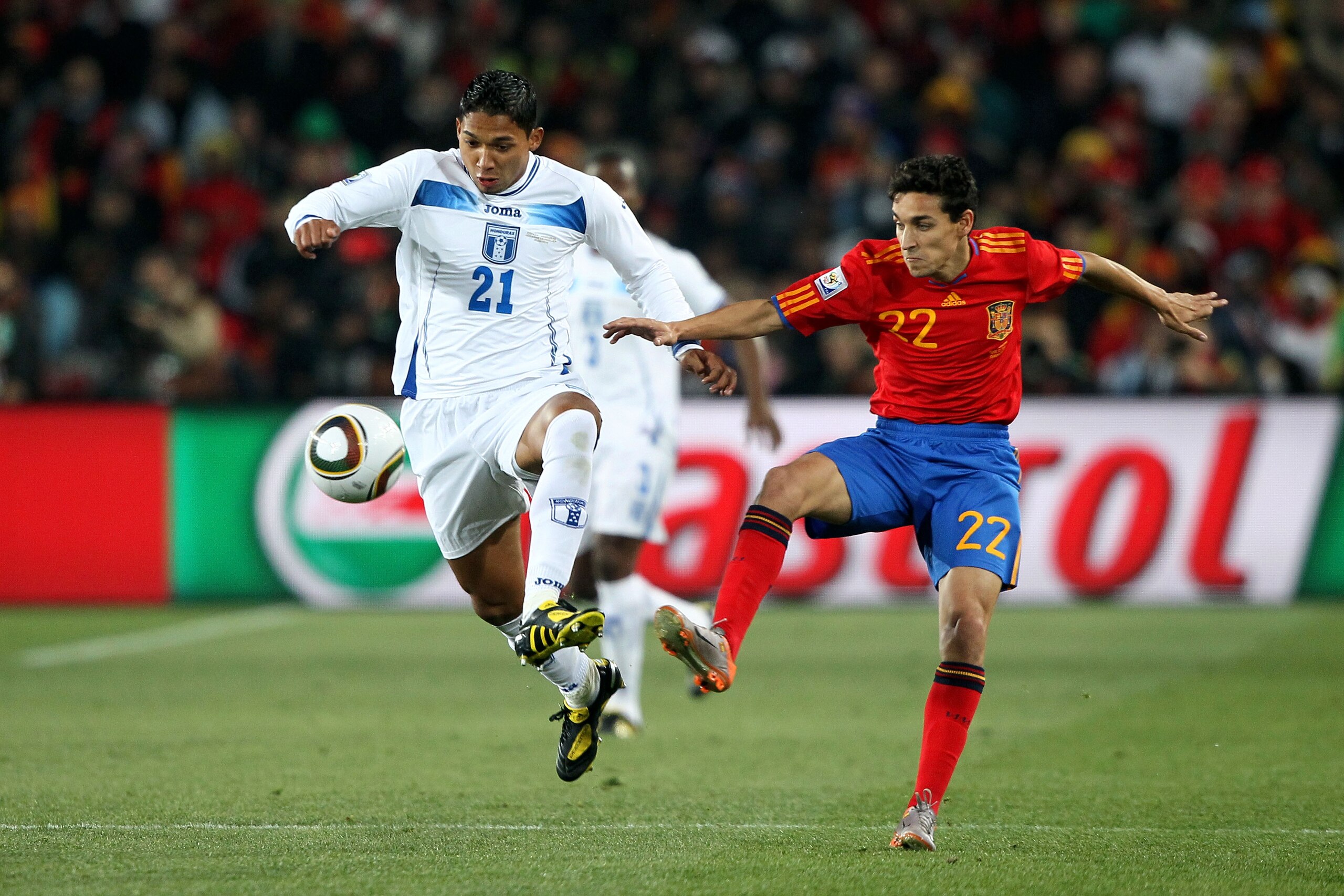 JOHANNESBURG, SOUTH AFRICA - JUNE 21: Emilio Izaguirre of Honduras and Jesus Navas of Spain battle for the ball during the 2010 FIFA World Cup South Africa Group H match between Spain and Honduras at Ellis Park Stadium on June 21, 2010 in Johannesburg, S JOHANNESBURG, SOUTH AFRICA - JUNE 21: Emilio Izaguirre of Honduras and Jesus Navas of Spain battle for the ball during the 2010 FIFA World Cup South Africa Group H match between Spain and Honduras at Ellis Park Stadium on June 21, 2010 in Johannesburg, S