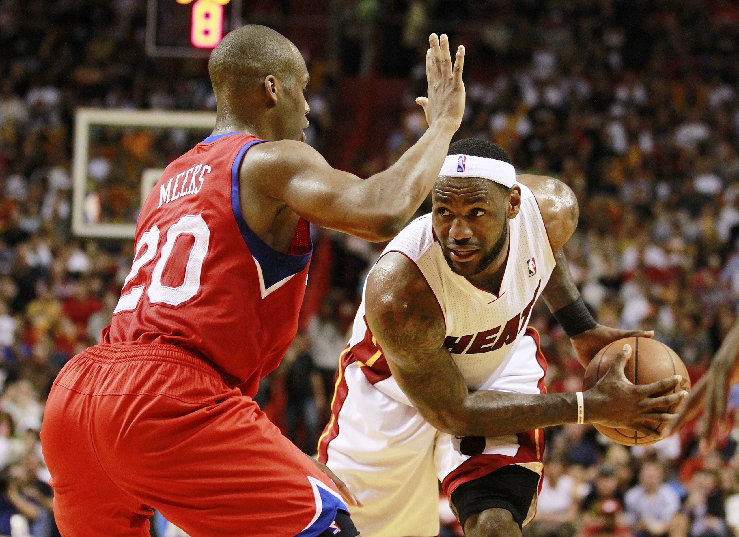 MIAMI, FL - MARCH 25: Forward LeBron James #6 of the Miami Heat drives against Guard Jodie Meeks #20 of the Philadelphia 76ers at American Airlines Arena on March 25, 2011 in Miami, Florida. The Heat defeated the Sixers 111-99. NOTE TO USER: User expres MIAMI, FL - MARCH 25: Forward LeBron James #6 of the Miami Heat drives against Guard Jodie Meeks #20 of the Philadelphia 76ers at American Airlines Arena on March 25, 2011 in Miami, Florida. The Heat defeated the Sixers 111-99. NOTE TO USER: User expres