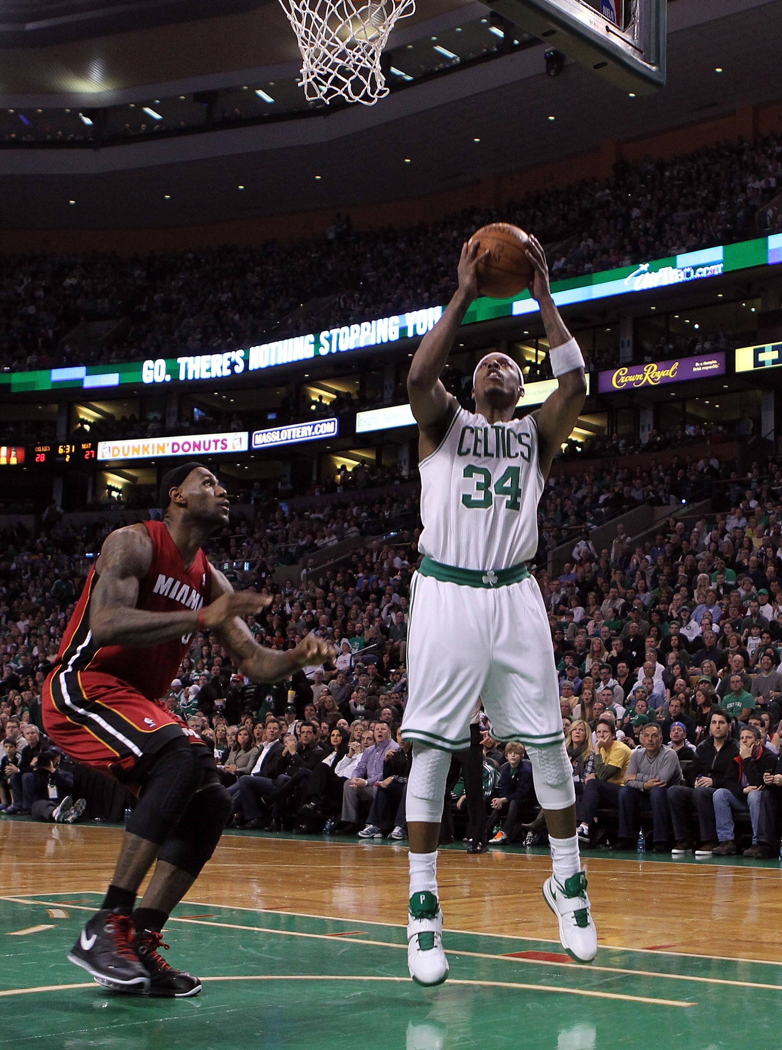 BOSTON - FEBRUARY 13: LeBron James #6 of the Miami Heat defends as Paul Pierce #34 of the Boston Celtics shots a basket at TD Garden on February 13, 2011 in Boston, Massachusetts. NOTE TO USER: User expressly acknowledges and agrees that, by downloading BOSTON - FEBRUARY 13: LeBron James #6 of the Miami Heat defends as Paul Pierce #34 of the Boston Celtics shots a basket at TD Garden on February 13, 2011 in Boston, Massachusetts. NOTE TO USER: User expressly acknowledges and agrees that, by downloading