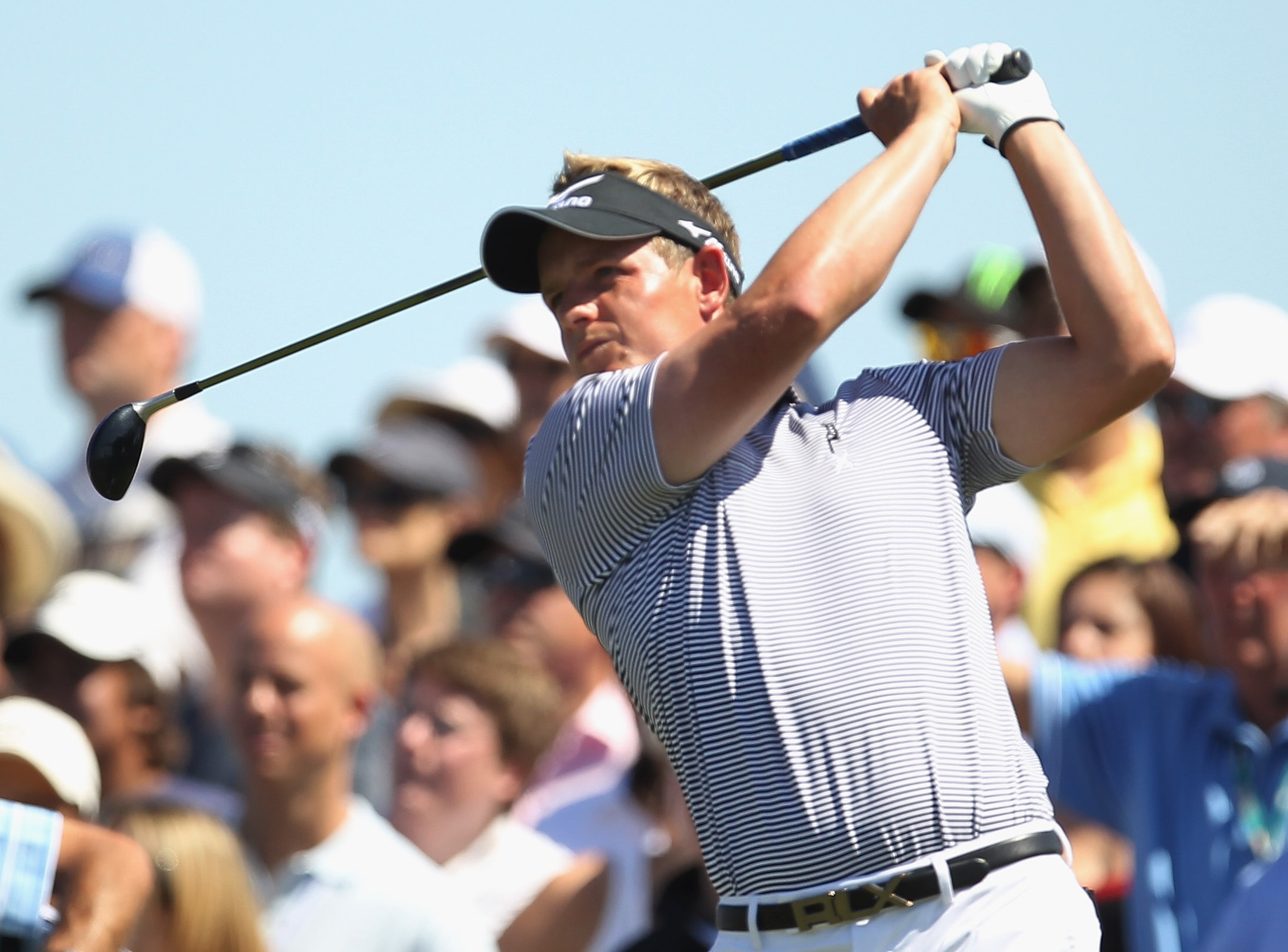 DORAL, FL - MARCH 13:  Luke Donald of England watches his tee shot on the second hole during the final round of the 2011 WGC- Cadillac Championship at the TPC Blue Monster at the Doral Golf Resort and Spa on March 13, 2011 in Doral, Florida.  (Photo by Mi