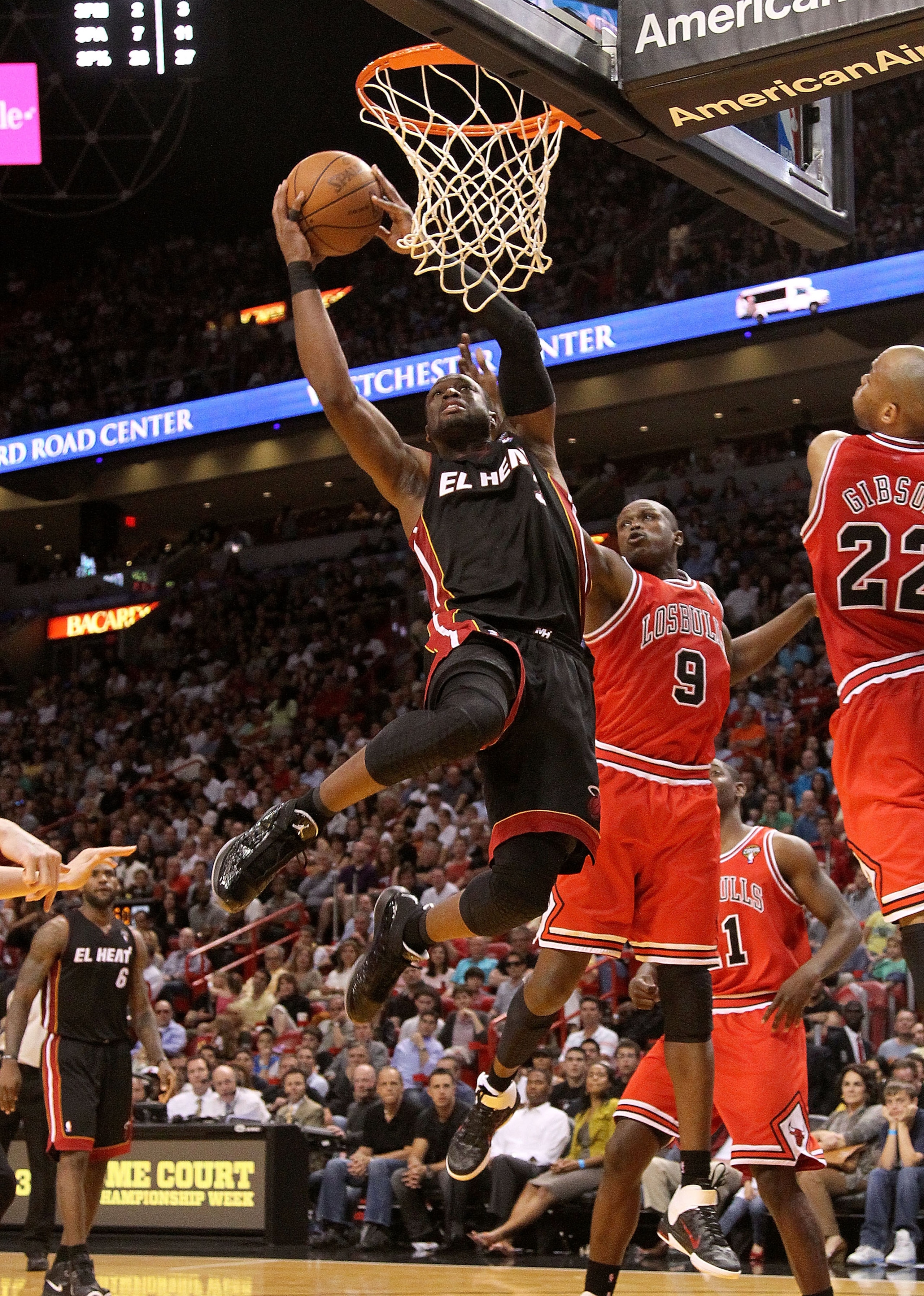 MIAMI, FL - MARCH 06: Dwyane Wade #3 of the Miami Heat shoots over Luol Deng #9 of the Chicago Bulls during a game at American Airlines Arena on March 6, 2011 in Miami, Florida. NOTE TO USER: User expressly acknowledges and agrees that, by downloading an MIAMI, FL - MARCH 06: Dwyane Wade #3 of the Miami Heat shoots over Luol Deng #9 of the Chicago Bulls during a game at American Airlines Arena on March 6, 2011 in Miami, Florida. NOTE TO USER: User expressly acknowledges and agrees that, by downloading an