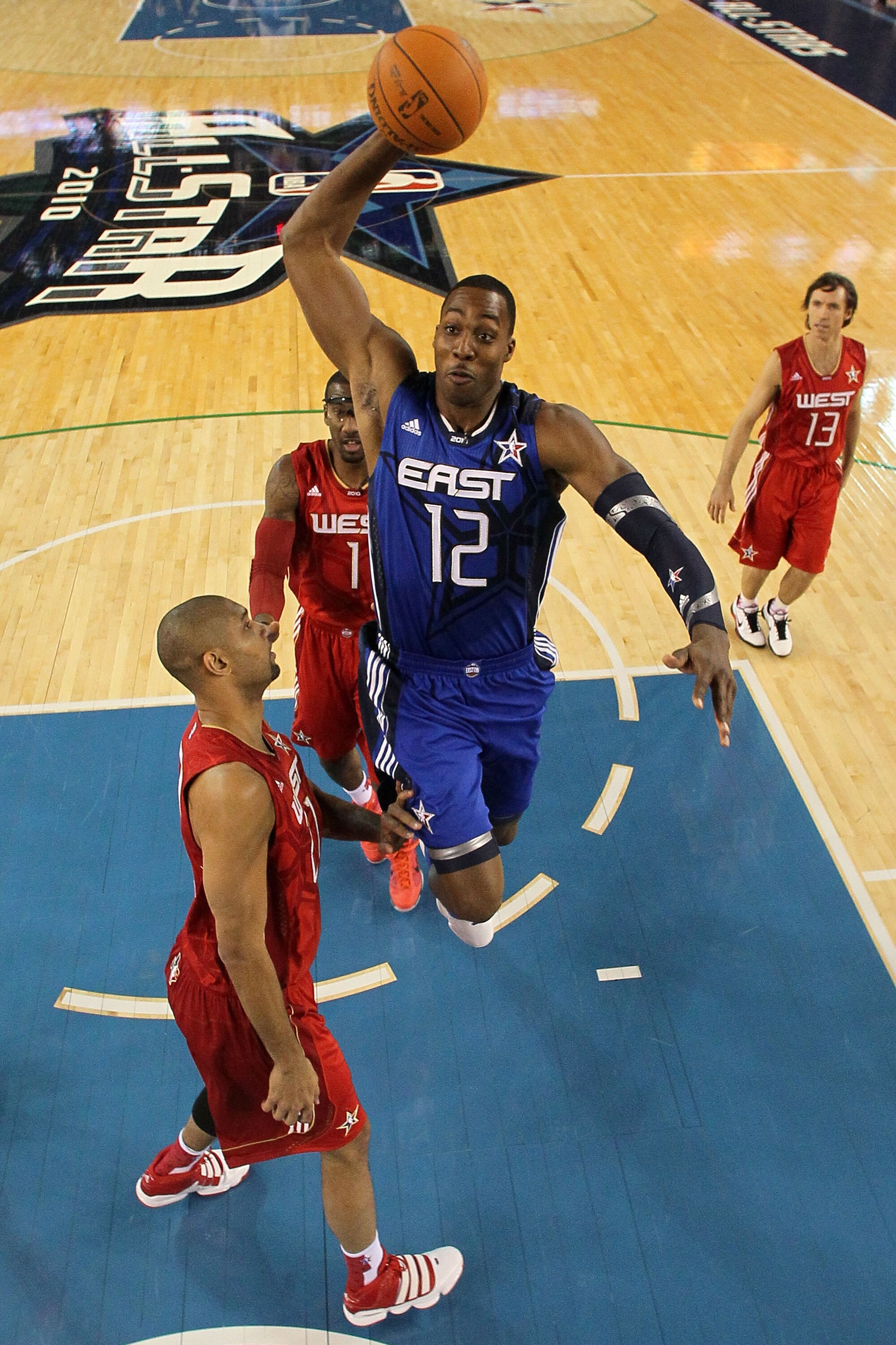 ARLINGTON, TX - FEBRUARY 14:  Dwight Howard #12 of the Eastern Conference goes up for a dunk against Tim Duncan #21, Amar'e Stoudemire #1 and Steve Nash #13 of the Western Conference during the second half of the NBA All-Star Game, part of 2010 NBA All-St