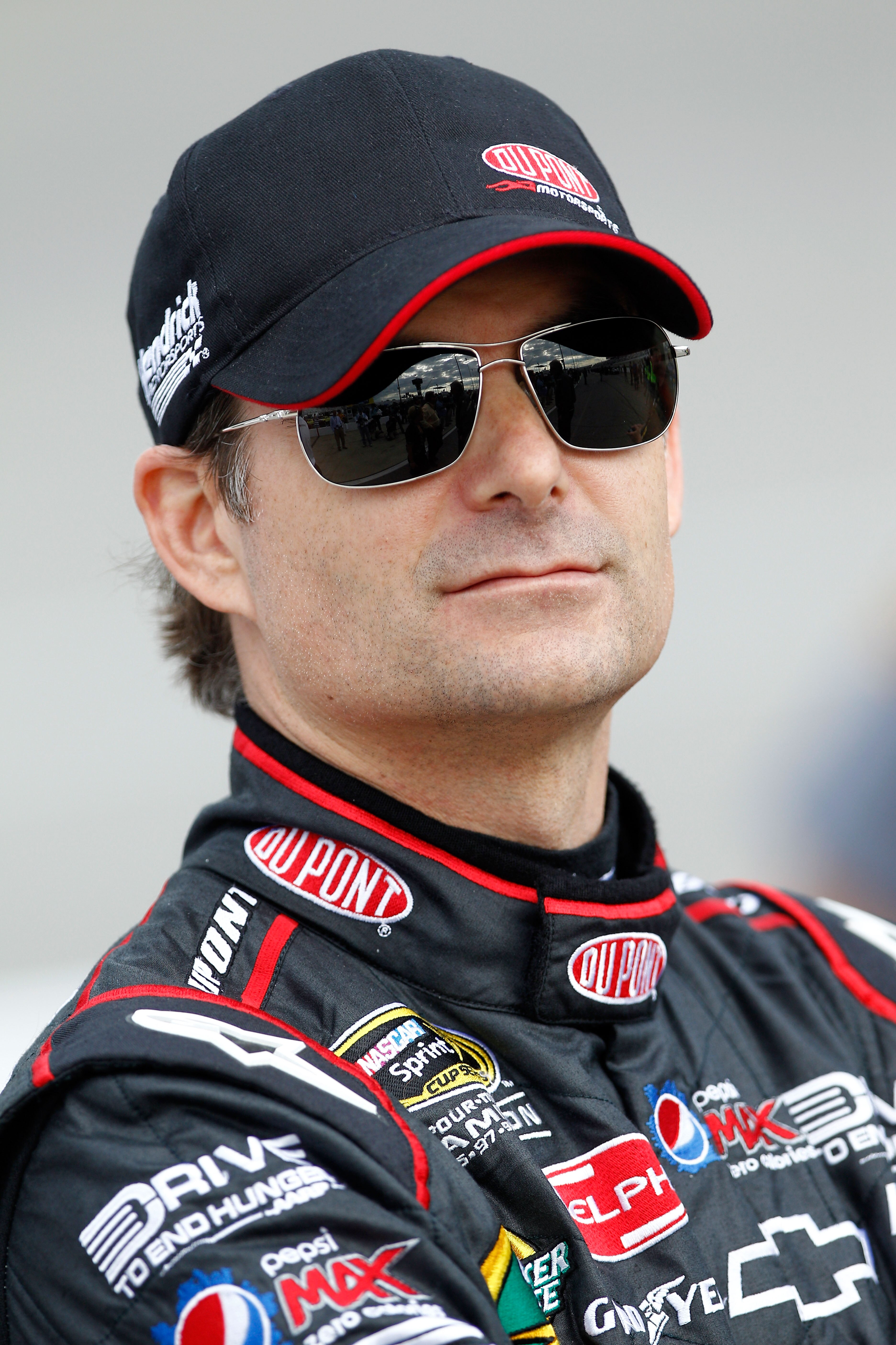 RICHMOND, VA - APRIL 29:  Jeff Gordon, driver of the #24 DuPont Chevrolet, stands on pit road during qualifying for the NASCAR Sprint Cup Series Crown Royal Presents The Matthew & Daniel Hansen 400 at Richmond International Raceway on April 29, 2011 in Ri