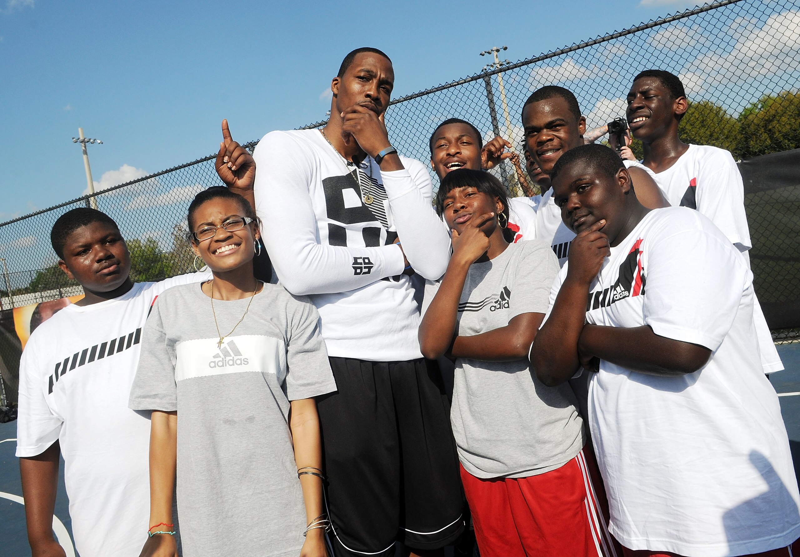 ORLANDO, FL - MARCH 17:  NBA All-Star Dwight Howard (center)  shows off his game face at an Orlando community center where he was on hand to capture kids' game faces for the next adidas commercial on March 17, 2011 in Orlando, Florida. Fans can visit www.