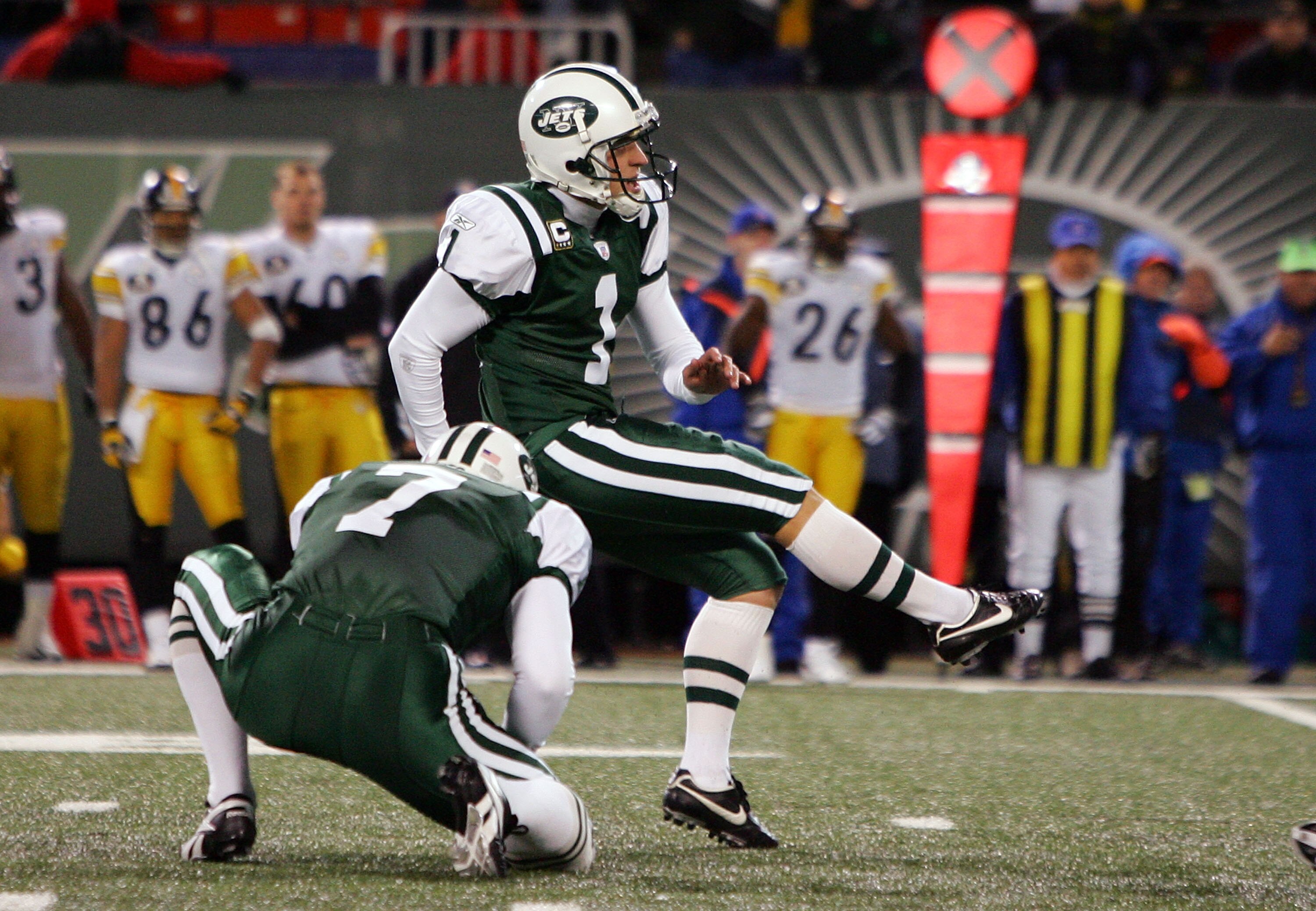 EAST RUTHERFORD, NJ - NOVEMBER 18:  Mike Nugent #1 of the New York Jets kicks the game-winning field goal against the Pittsburgh Steelers at Giants Stadium November 18, 2007 in East Rutherford, New Jersey. The Jets defeated the Steelers 19-16 in overtime.