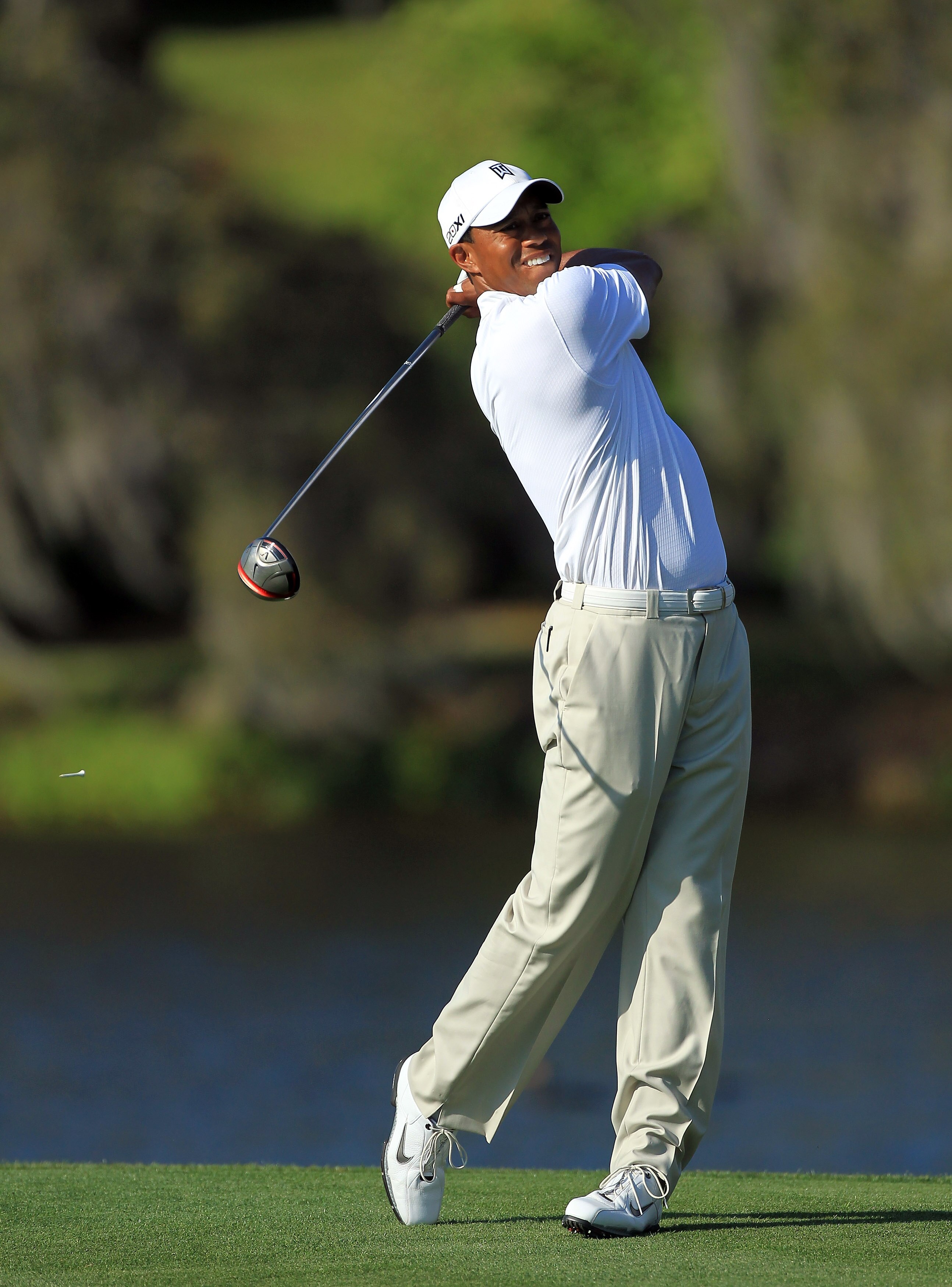 ORLANDO, FL - MARCH 24:  Tiger Woods of the USA plays his tee shot at the 16th hole during the first round of the 2011 Arnold Palmer Invitational presented by Mastercard at the Bay Hill Lodge and Country Club on March 24, 2011 in Orlando, Florida.  (Photo