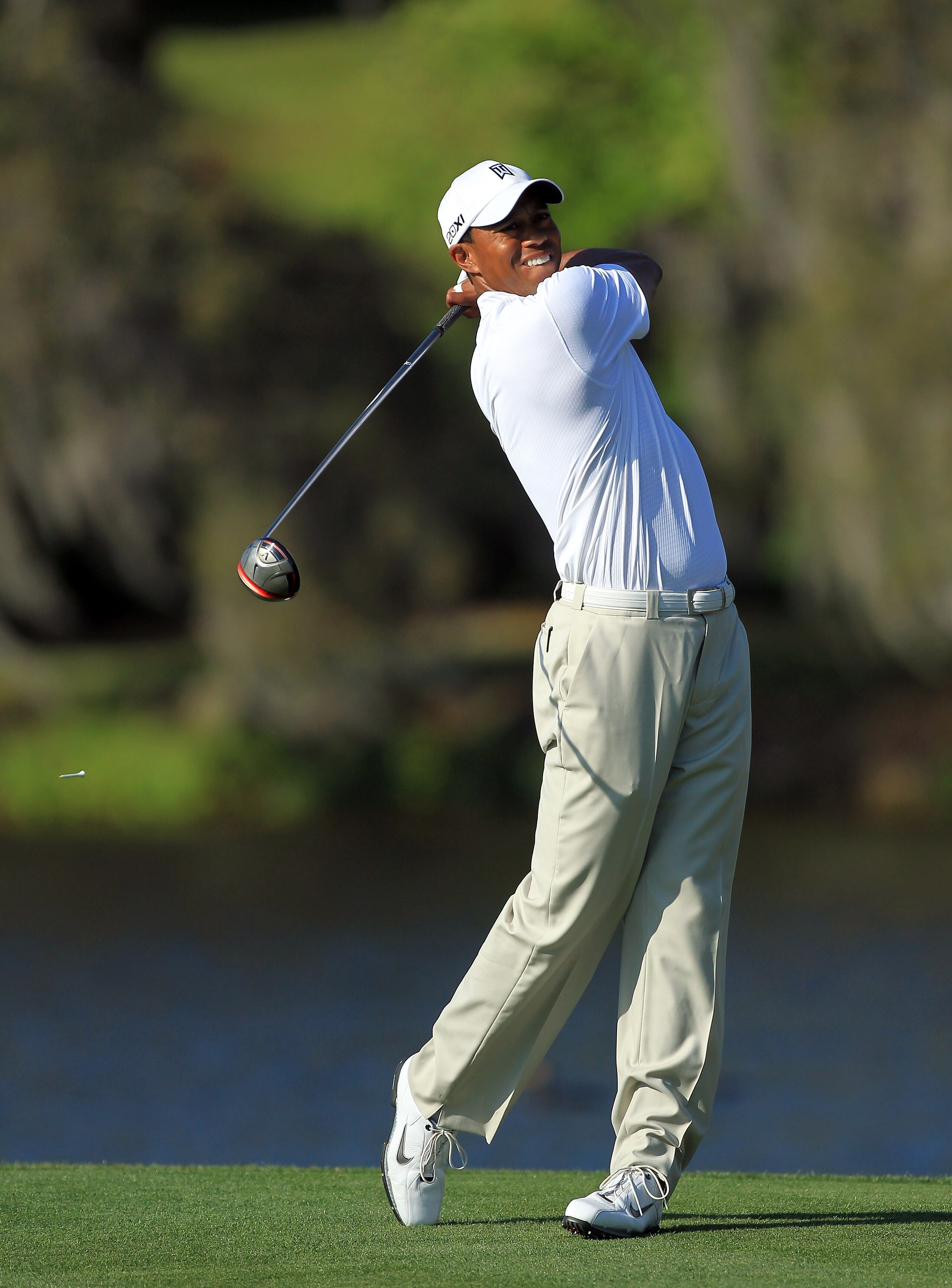 ORLANDO, FL - MARCH 24:  Tiger Woods of the USA plays his tee shot at the 16th hole during the first round of the 2011 Arnold Palmer Invitational presented by Mastercard at the Bay Hill Lodge and Country Club on March 24, 2011 in Orlando, Florida.  (Photo