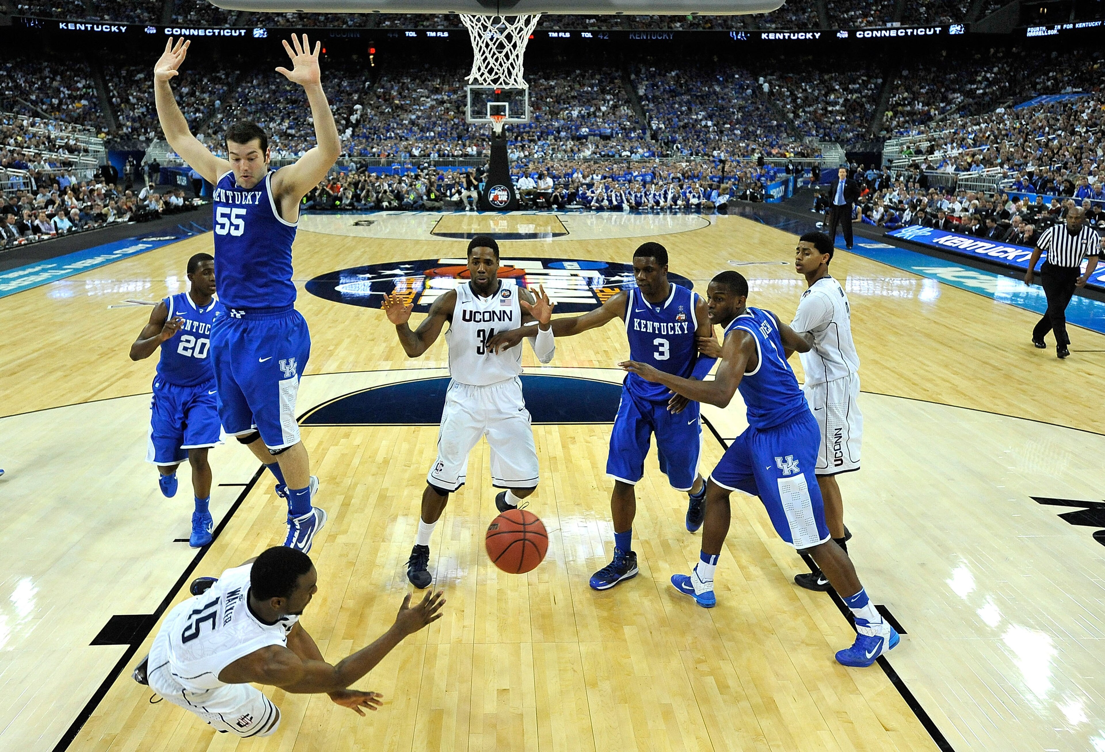 HOUSTON, TX - APRIL 02:  Kemba Walker #15 of the Connecticut Huskies dives to save a ball from going out of bounds against the Kentucky Wildcats during the National Semifinal game of the 2011 NCAA Division I Men's Basketball Championship at Reliant Stadiu