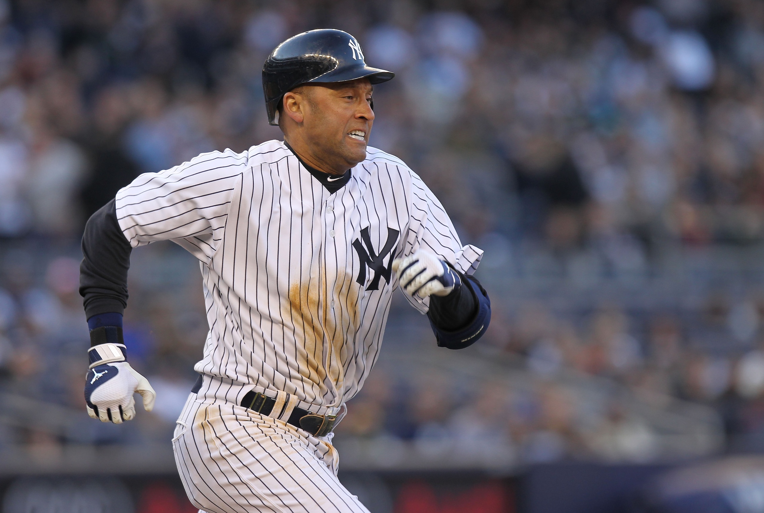 NEW YORK, NY - APRIL 02: Derek Jeter #2 of the New York Yankees runs up the first base line on an infield single against the Detroit Tigers at Yankee Stadium on April 2, 2011 in the Bronx borough of New York City.  (Photo by Nick Laham/Getty Images)
