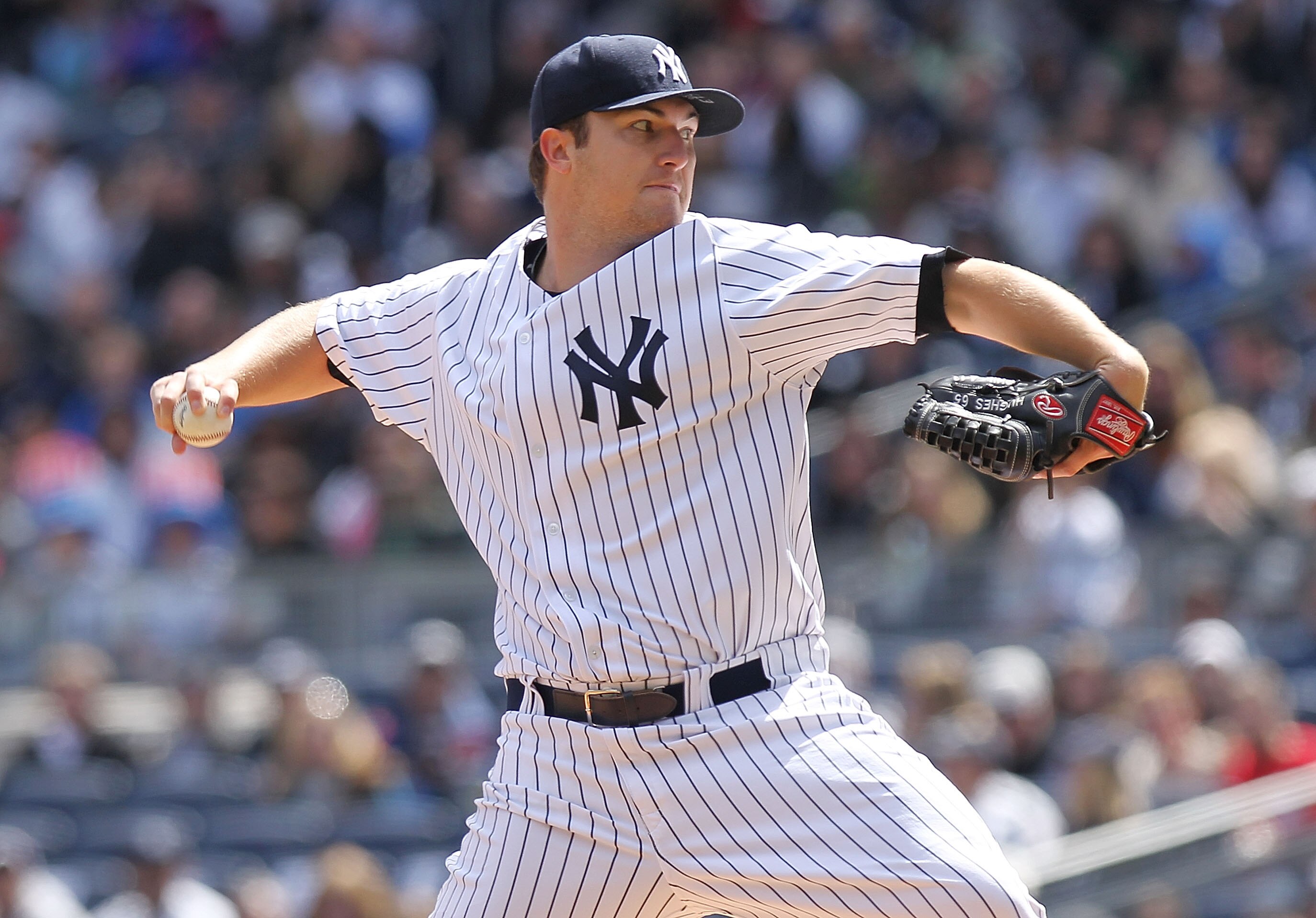 NEW YORK, NY - APRIL 03:  Phil Hughes #65 of the New York Yankees pitches against the Detroit Tigers at Yankee Stadium on April 3, 2011 in the Bronx borough of New York City.  (Photo by Nick Laham/Getty Images)
