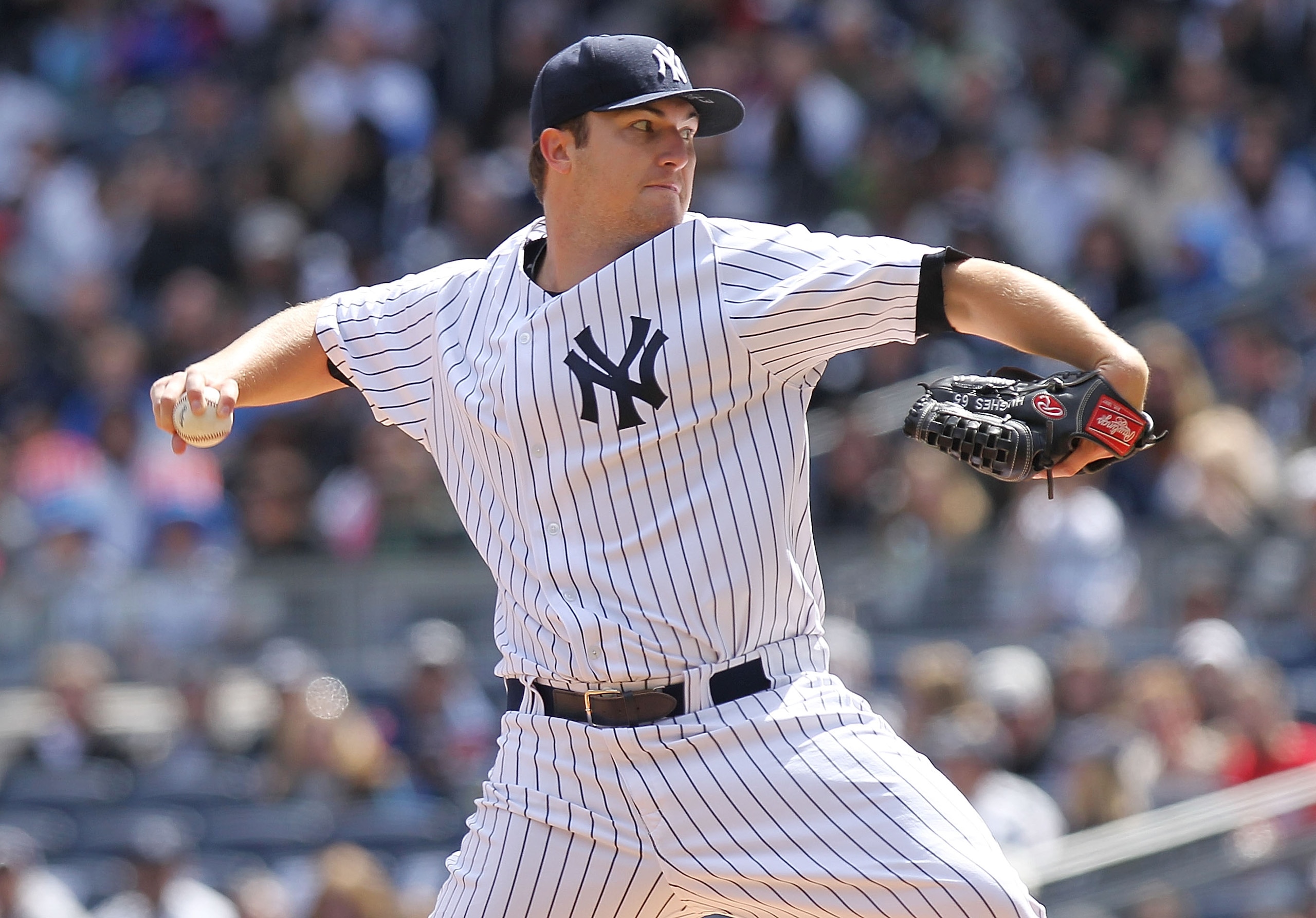 NEW YORK, NY - APRIL 03:  Phil Hughes #65 of the New York Yankees pitches against the Detroit Tigers at Yankee Stadium on April 3, 2011 in the Bronx borough of New York City.  (Photo by Nick Laham/Getty Images)