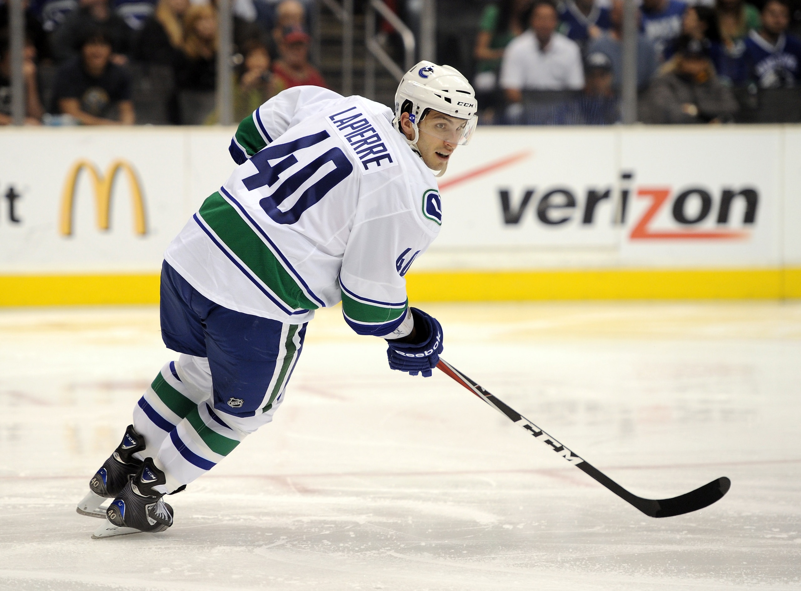 LOS ANGELES, CA - MARCH 05:  Maxim Lapierre #40 of the Vancouver Canucks forechecks against the Los Angeles Kings at the Staples Center on March 5, 2011 in Los Angeles, California.  (Photo by Harry How/Getty Images)