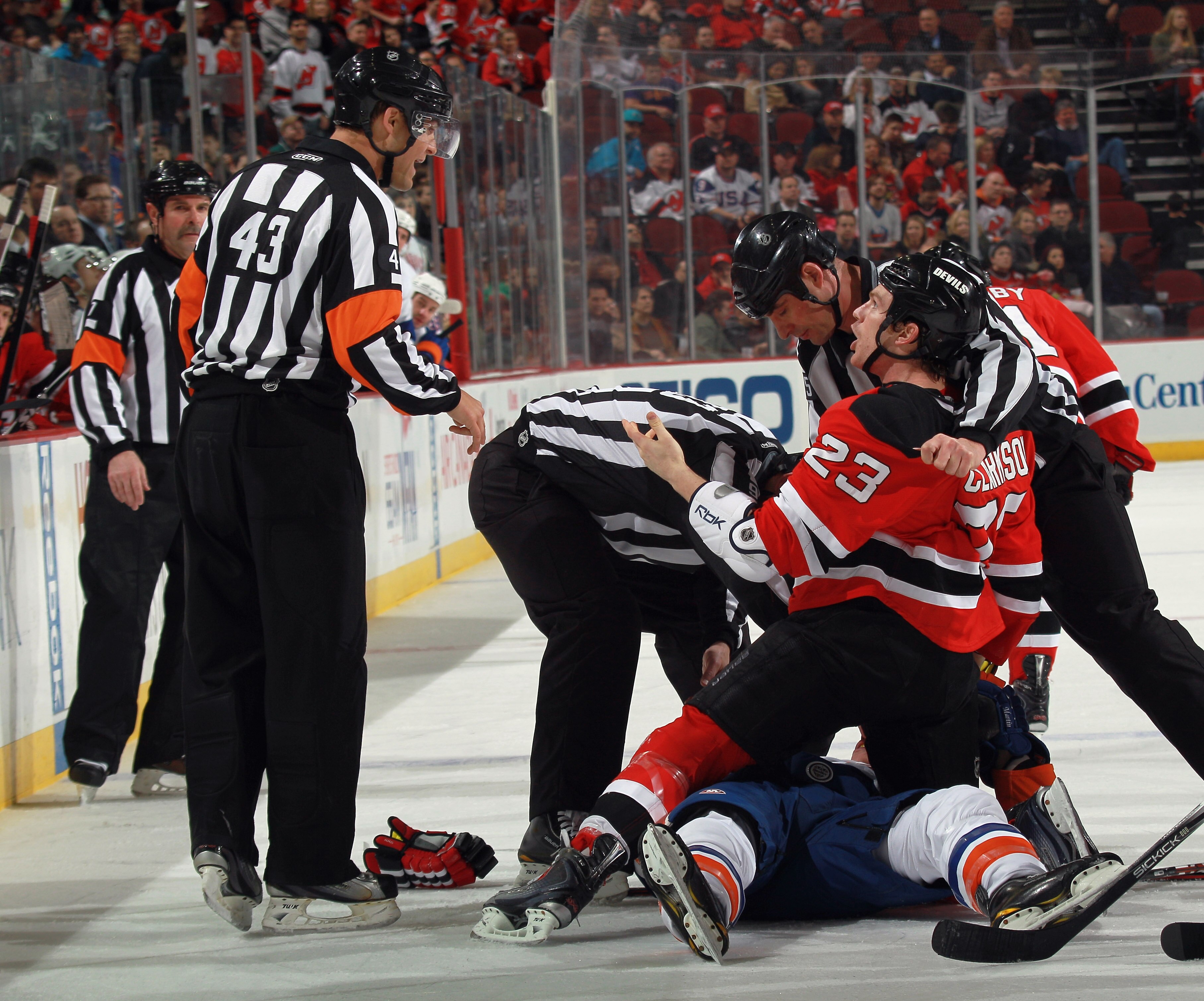 NEWARK, NJ - MARCH 30: Working his first NHL game, referee Jean Hebert #43 gives instructions to David Clarkson #23 of the New Jersey Devils in the game against the New York Islanders at the Prudential Center on March 30, 2011 in Newark, New Jersey. Matt