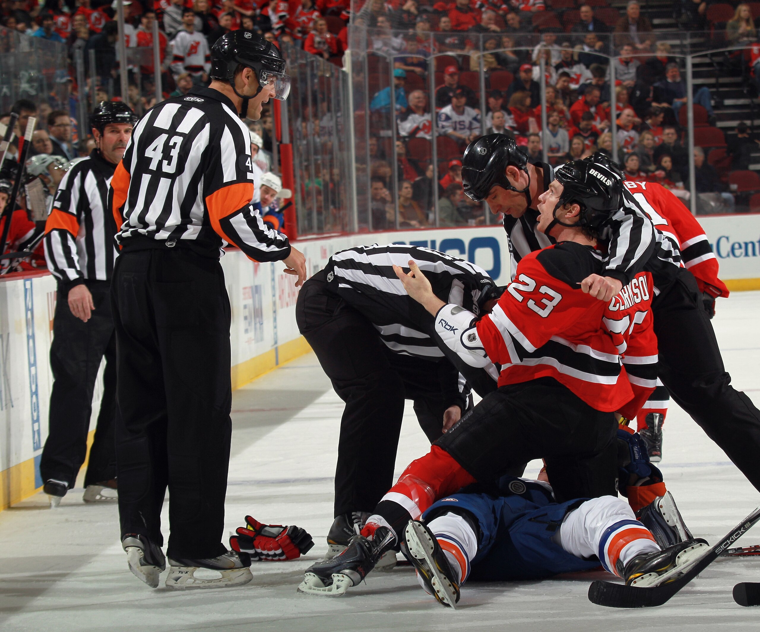 NEWARK, NJ - MARCH 30: Working his first NHL game, referee Jean Hebert #43 gives instructions to David Clarkson #23 of the New Jersey Devils in the game against the New York Islanders at the Prudential Center on March 30, 2011 in Newark, New Jersey. Matt