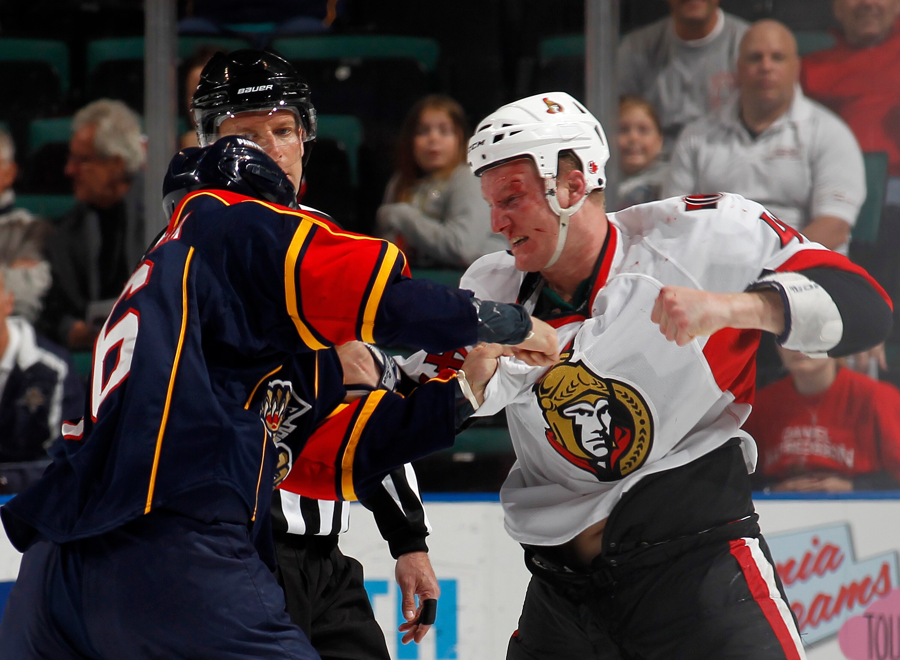 SUNRISE, FL - MARCH 31: Francis Lessard #49 of the Ottawa Senators and Darcy Hordichuk #16 of the Florida Panthers fight during the first period on March 31, 2011 at the BankAtlantic Center in Sunrise, Florida. (Photo by Joel Auerbach/Getty Images)