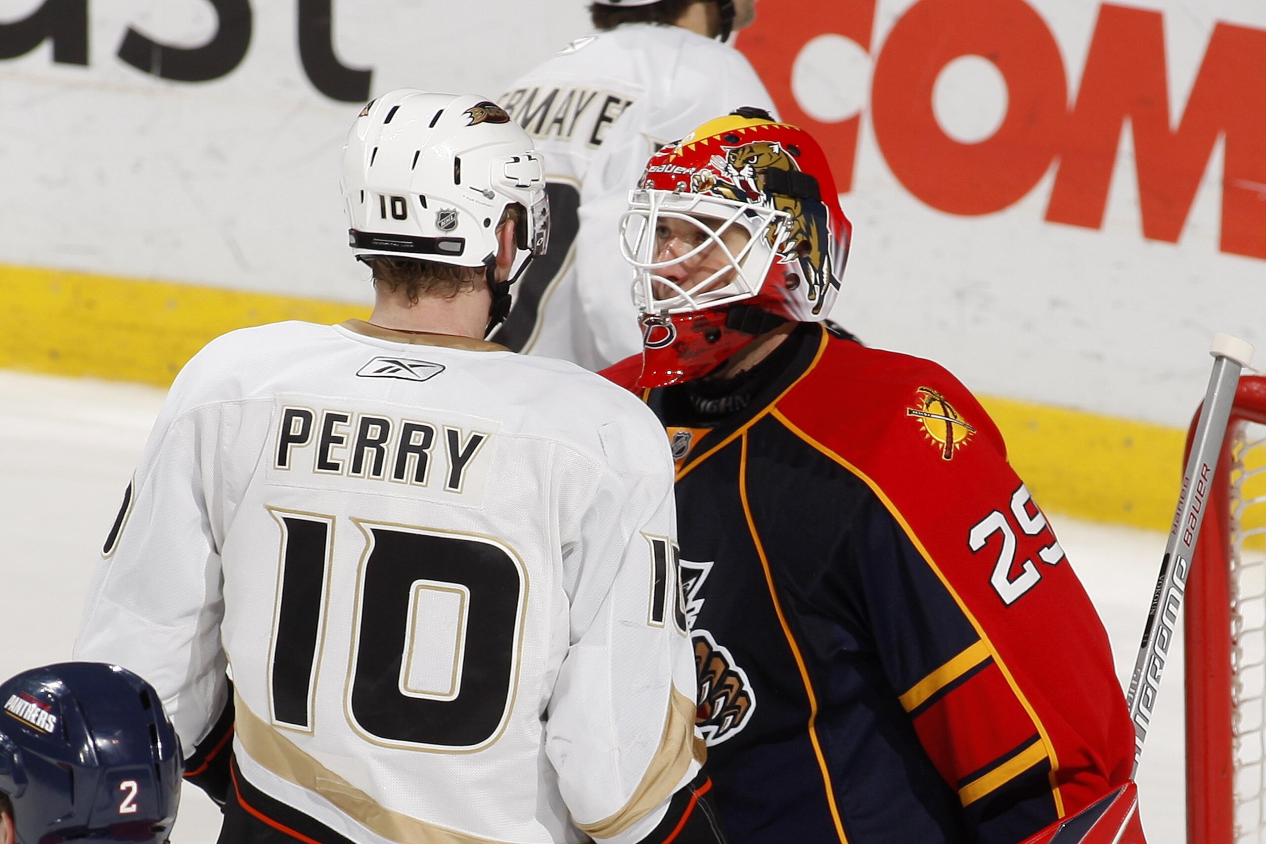 SUNRISE, FL - FEBRUARY 1: Goaltender Tomas Vokoun #29 of the Florida Panthers and Corey Perry #10 of the Anaheim Ducks exchange words after Vokoun hit Perry in the back with his stick in an attempt to clear the crease area of the net on February 1, 2010 a