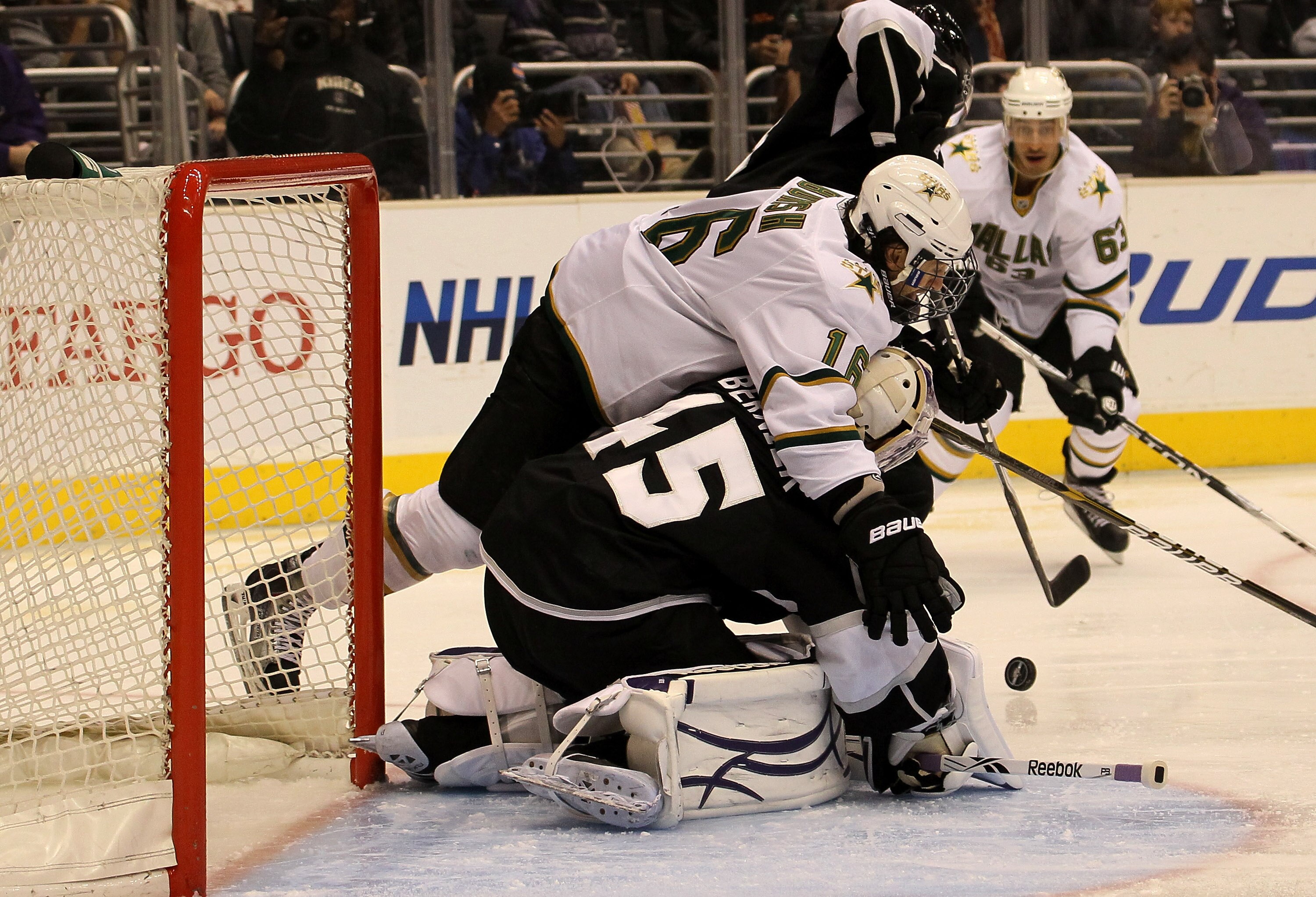 LOS ANGELES, CA - MARCH 07:  Adam Burish #16 of the Dallas Stars collides with goalie Jonathan Bernier #45 of the Los Angeles Kings at Staples Center on March 7, 2011 in Los Angeles, California.  (Photo by Stephen Dunn/Getty Images)