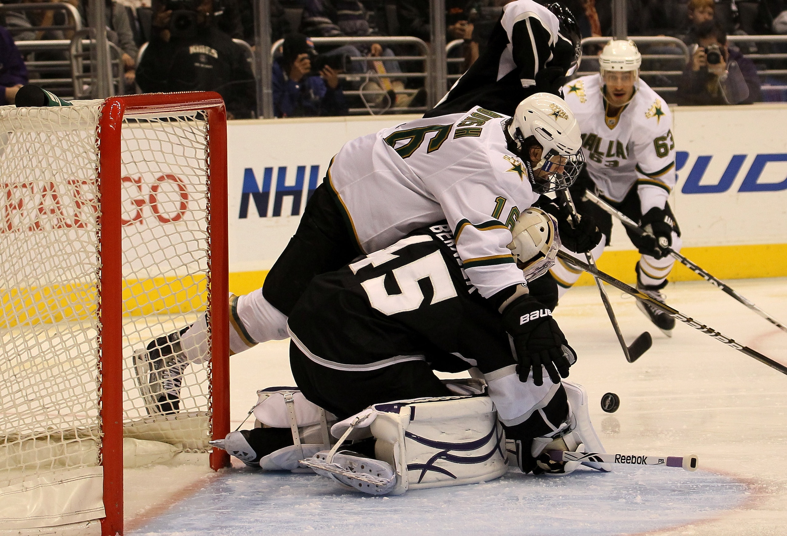 LOS ANGELES, CA - MARCH 07:  Adam Burish #16 of the Dallas Stars collides with goalie Jonathan Bernier #45 of the Los Angeles Kings at Staples Center on March 7, 2011 in Los Angeles, California.  (Photo by Stephen Dunn/Getty Images)