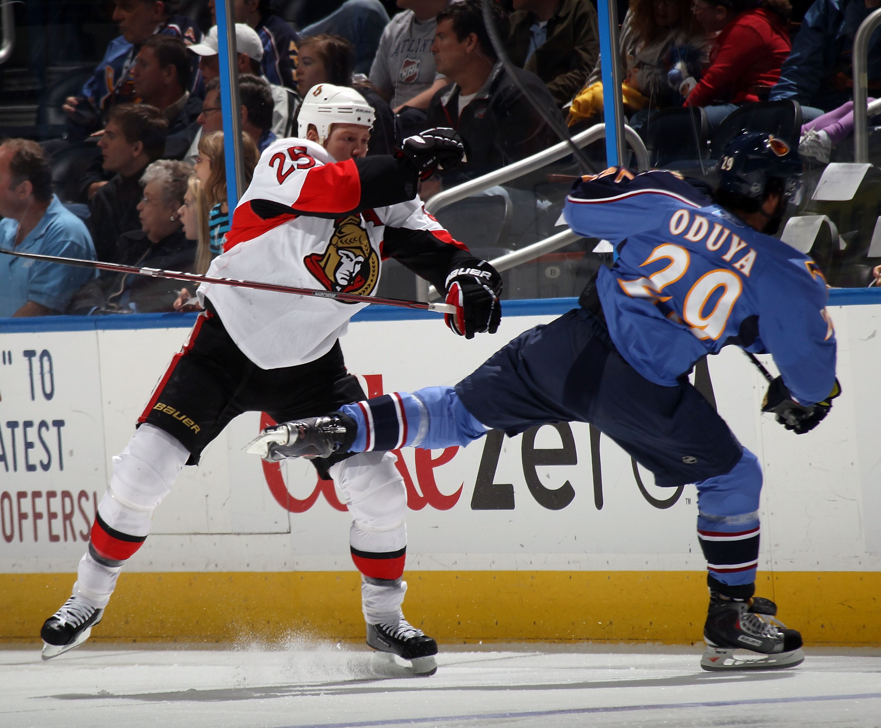 ATLANTA, GA - MARCH 27: Chris Neil #25 of the Ottawa Senators hits Johnny Oduya #29 of the Atlanta Thrashers at the Philips Arena on March 27, 2011 in Atlanta, Georgia.  (Photo by Bruce Bennett/Getty Images)