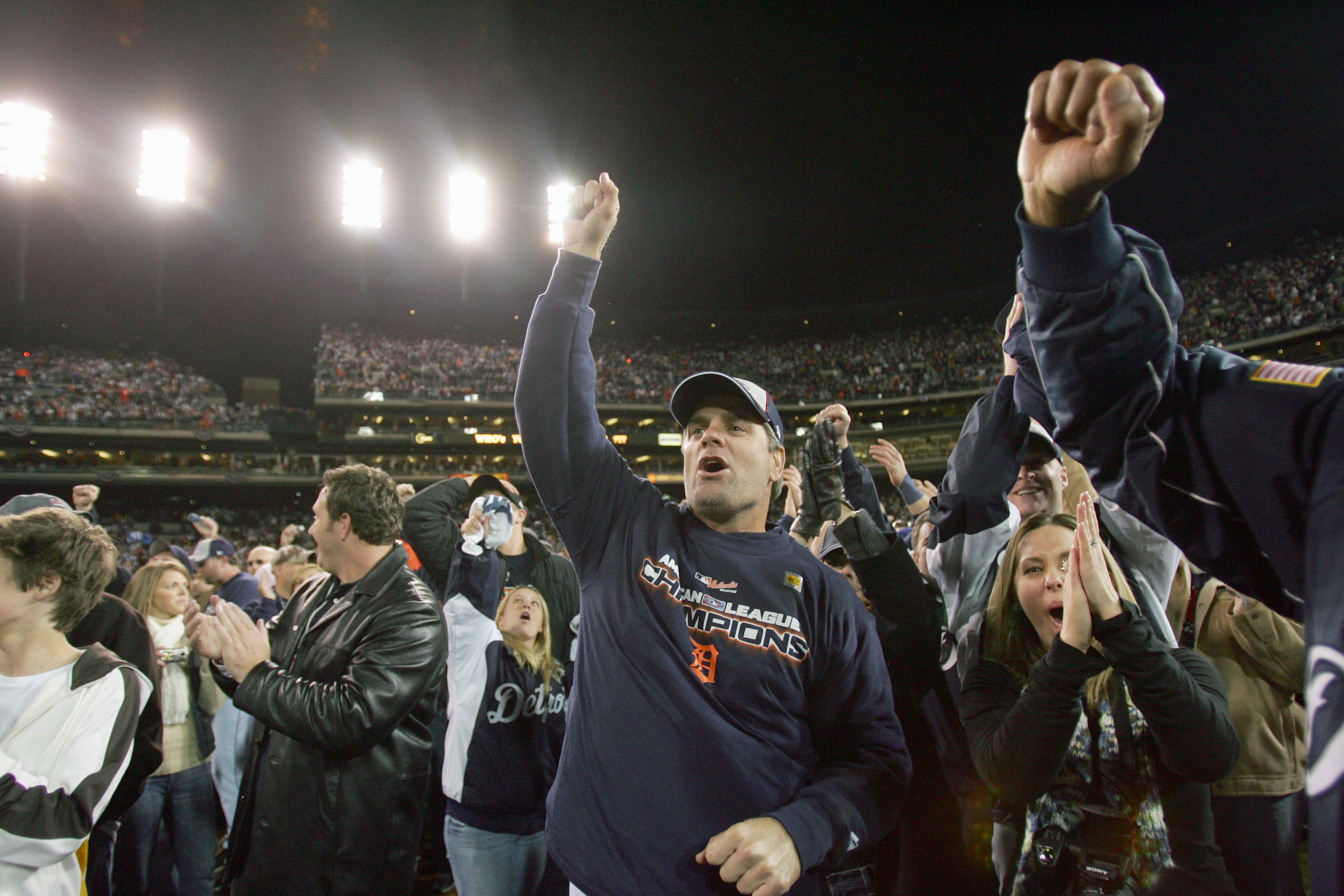 DETROIT - OCTOBER 14:  Fans of the Detroit Tigers celebrates after winning Game Four of the American League Championship Series against the Oakland Athletics on October 14, 2006 at Comerica Park in Detroit, Michigan. (Photo by Jed Jacobsohn/Getty Images)