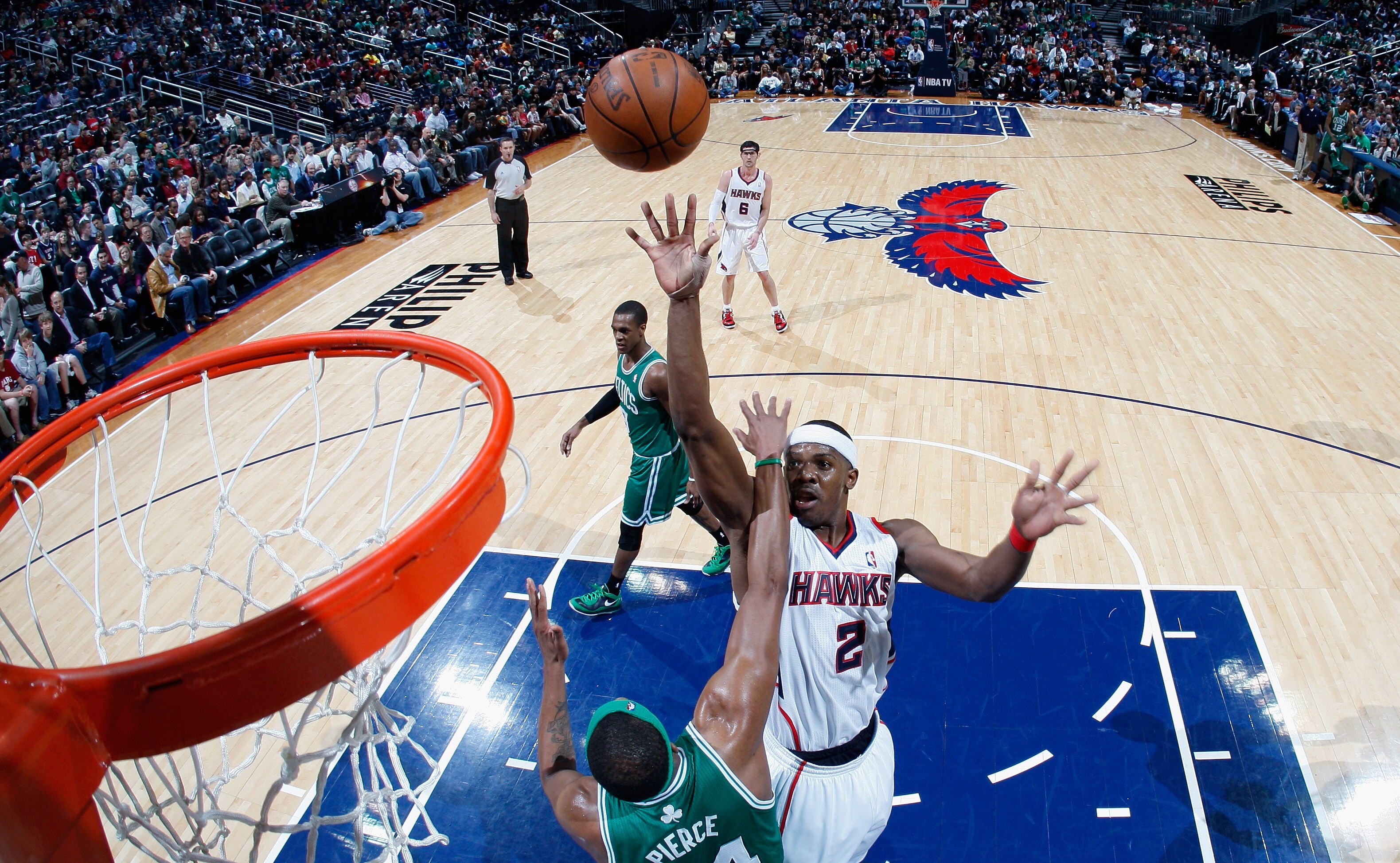 ATLANTA, GA - APRIL 01:  Paul Pierce #34 of the Boston Celtics defends against Joe Johnson #2 of the Atlanta Hawks at Philips Arena on April 1, 2011 in Atlanta, Georgia.  NOTE TO USER: User expressly acknowledges and agrees that, by downloading and/or usi