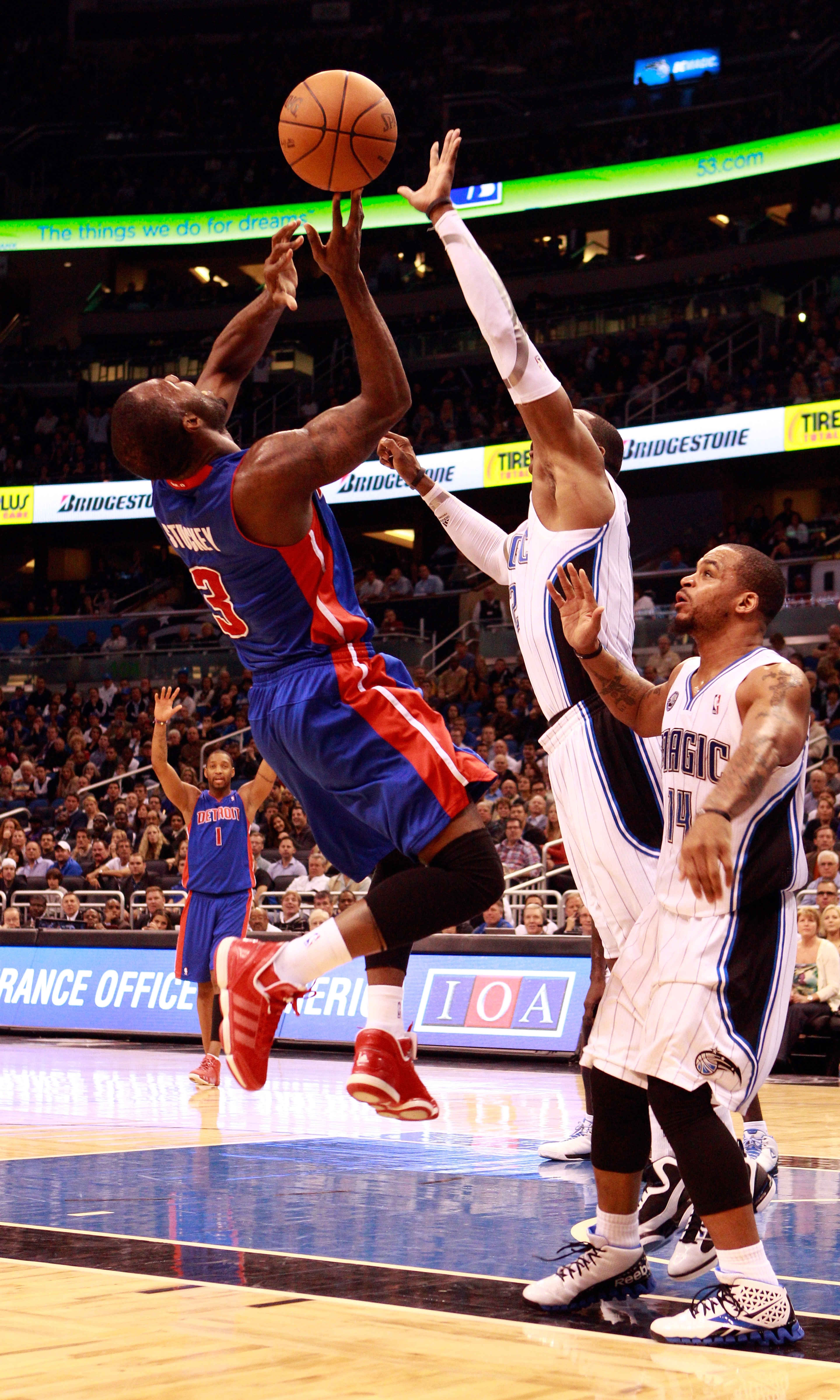 ORLANDO, FL - JANUARY 24:   Rodney Stuckey #3 of the Detroit Pistons attempts a shot against Dwight Howard #12 and Jameer Nelson #14 of the Orlando Magic during the game at Amway Arena on January 24, 2011 in Orlando, Florida.  NOTE TO USER: User expressly