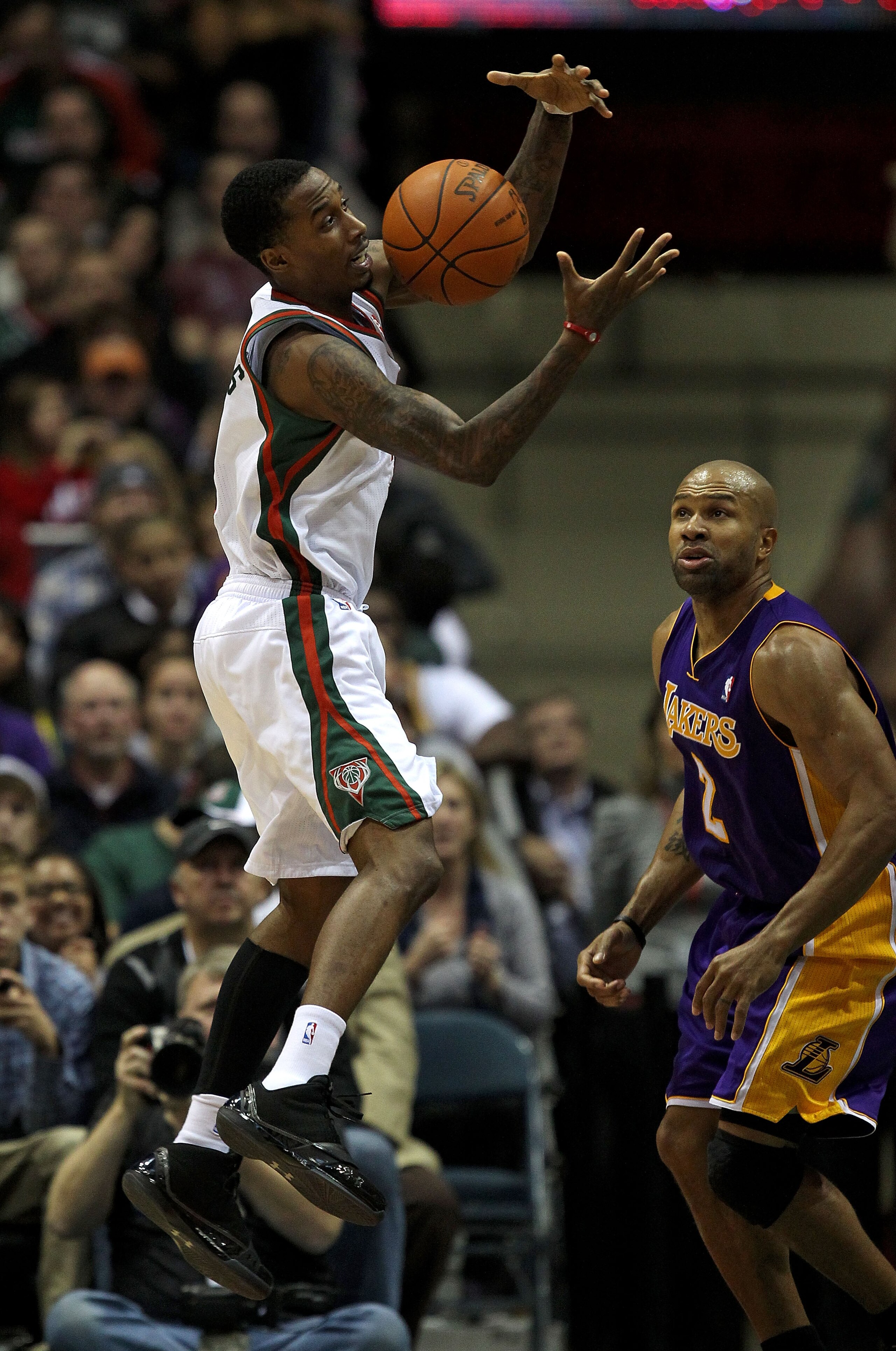 MILWAUKEE - NOVEMBER 16: Brandon Jennings #3 of the Milwaukee Bucks grabs the ball in front of Derek Fisher #2 of the Los Angeles Lakers at the Bradley Center on November 16, 2010 in Milwaukee, Wisconsin. The Lakers defeated the Bucks 118-107. NOTE TO USE MILWAUKEE - NOVEMBER 16: Brandon Jennings #3 of the Milwaukee Bucks grabs the ball in front of Derek Fisher #2 of the Los Angeles Lakers at the Bradley Center on November 16, 2010 in Milwaukee, Wisconsin. The Lakers defeated the Bucks 118-107. NOTE TO USE