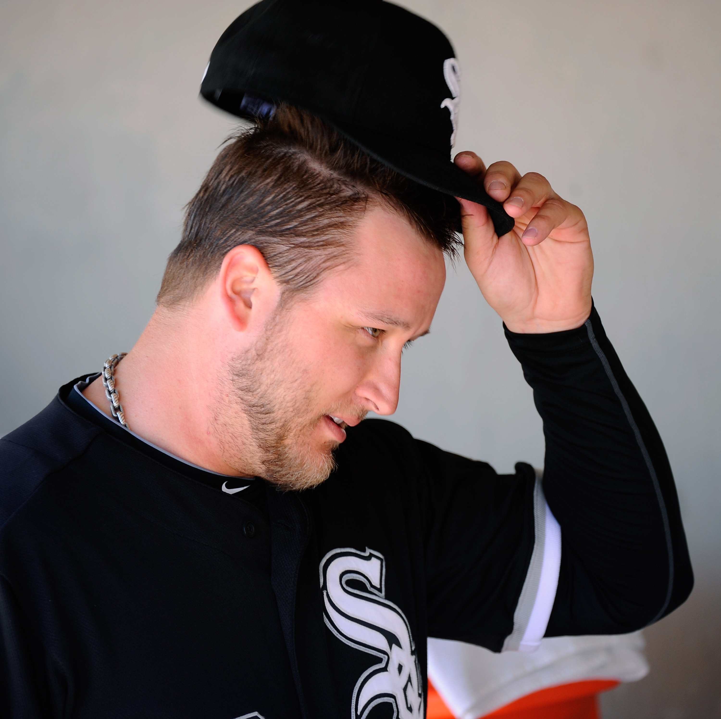 GLENDALE, AZ - MARCH 11:  Pitcher Mark Buehrle #56 of the Chicago White Sox in the dugout prior to the start of the spring training baseball game against the Chicago Cubs at Camelback Ranch on March 11, 2011 in Glendale, Arizona.  (Photo by Kevork Djansez