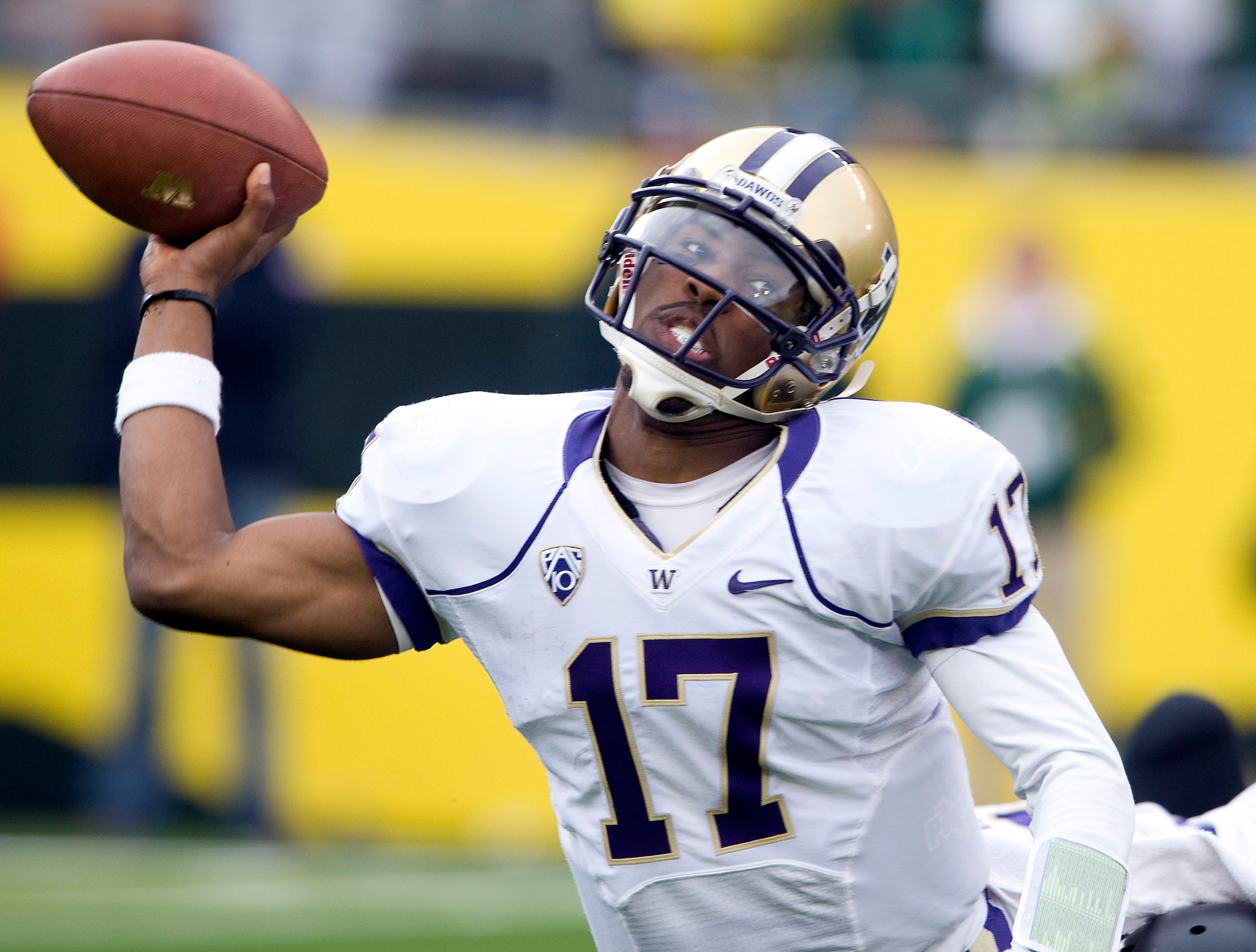 EUGENE, OR - NOVEMBER 06: Quarterback Keith Price #17 of the Washington Huskies throws the ball as he is tackled in the third quarter of the game against the Oregon Ducks at Autzen Stadium on November 6, 2010 in Eugene, Oregon. The Ducks won the game 53-1 EUGENE, OR - NOVEMBER 06: Quarterback Keith Price #17 of the Washington Huskies throws the ball as he is tackled in the third quarter of the game against the Oregon Ducks at Autzen Stadium on November 6, 2010 in Eugene, Oregon. The Ducks won the game 53-1