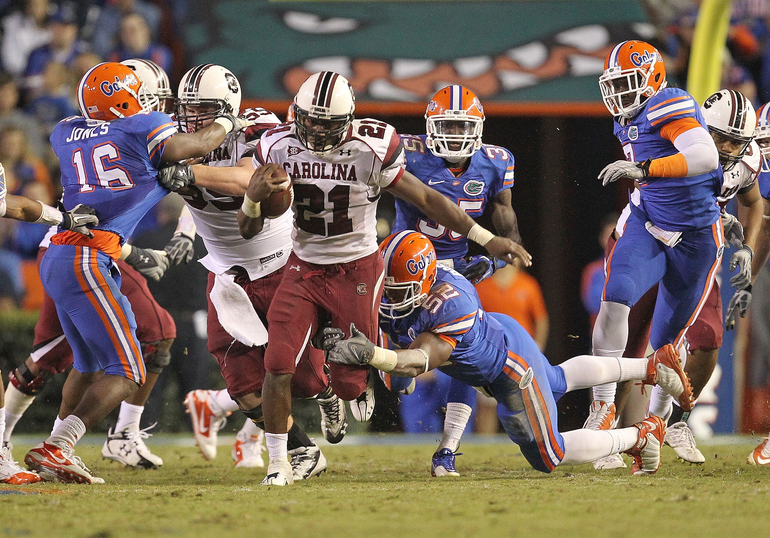 GAINESVILLE, FL - NOVEMBER 13: Marcus Lattimore #21 of the South Carolina Gamecocks rushes against Jonathan Bostic #52 of the Florida Gators at Ben Hill Griffin Stadium on November 13, 2010 in Gainesville, Florida. (Photo by Mike Ehrmann/Getty Images) GAINESVILLE, FL - NOVEMBER 13: Marcus Lattimore #21 of the South Carolina Gamecocks rushes against Jonathan Bostic #52 of the Florida Gators at Ben Hill Griffin Stadium on November 13, 2010 in Gainesville, Florida. (Photo by Mike Ehrmann/Getty Images)
