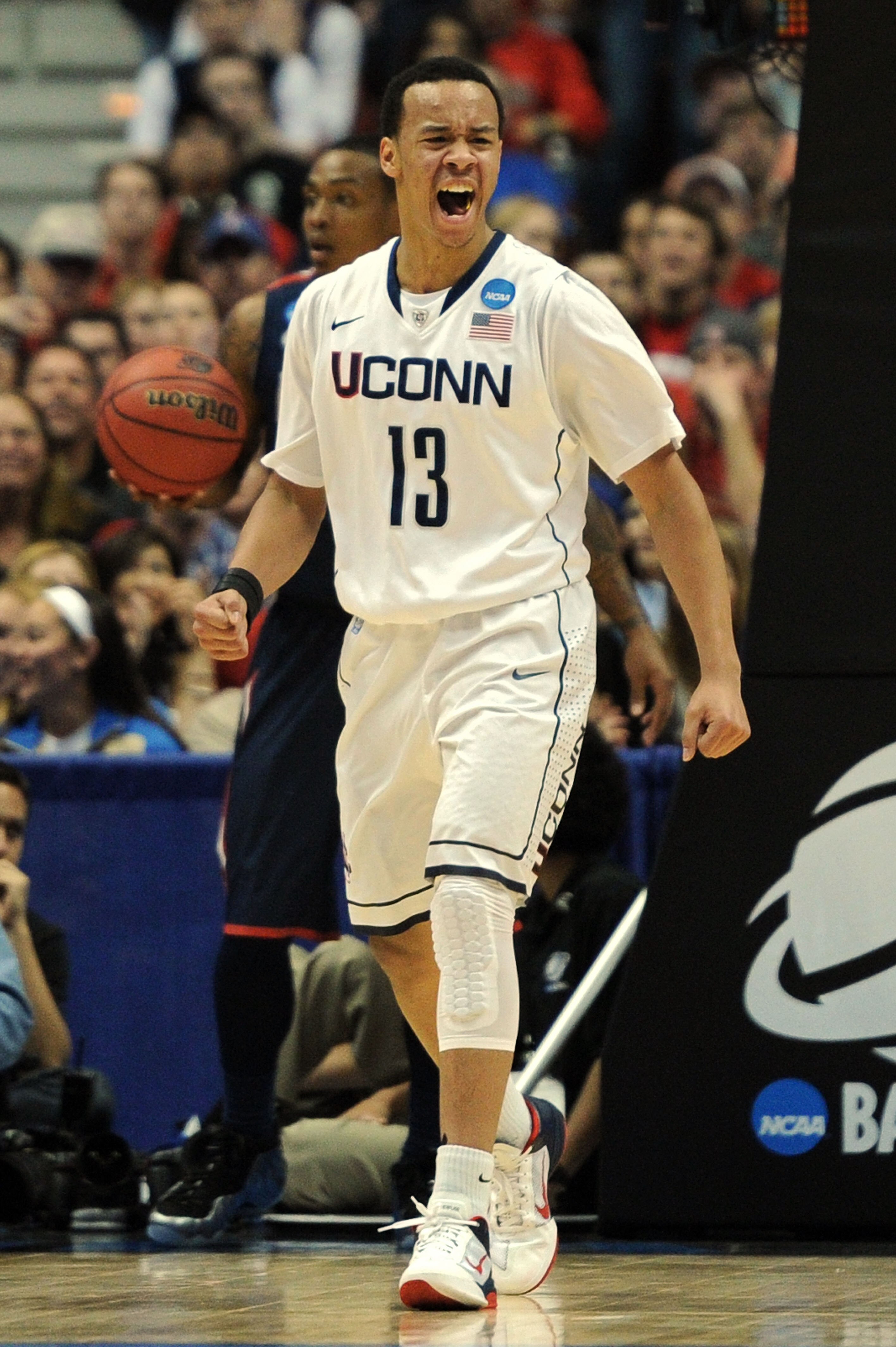 ANAHEIM, CA - MARCH 26:  Shabazz Napier #13 of the Connecticut Huskies reacts after a basket against the Connecticut Huskies during the west regional final of the 2011 NCAA men's basketball tournament at the Honda Center on March 26, 2011 in Anaheim, Cali