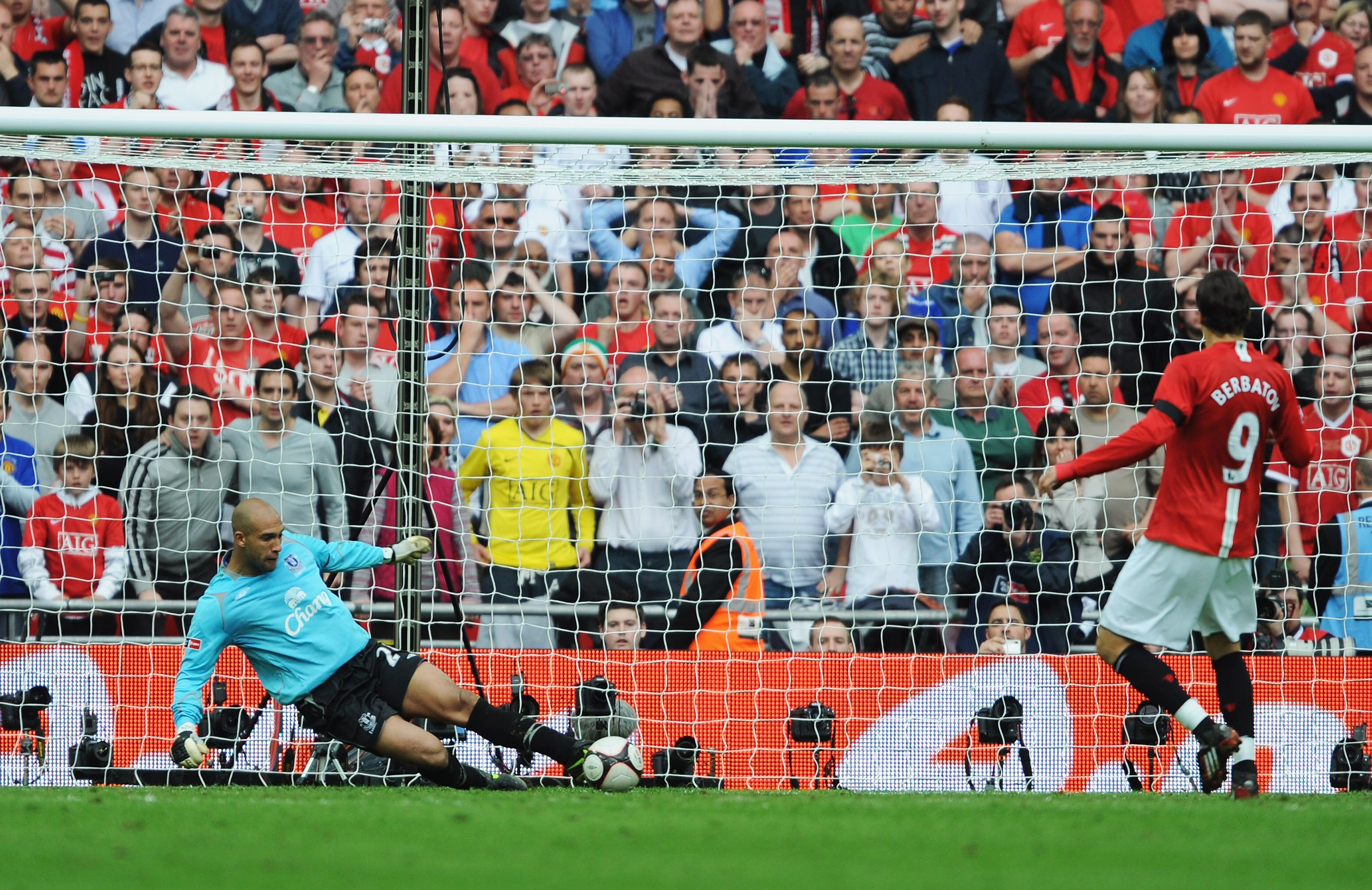 LONDON, ENGLAND - APRIL 19:  Tim Howard of Everton saves a penalty from Dimitar Berbatov of Manchester United in the shoot out during the FA Cup sponsored by E.ON Semi Final match between Everton and Manchester United at Wembley Stadium on April 19, 2009