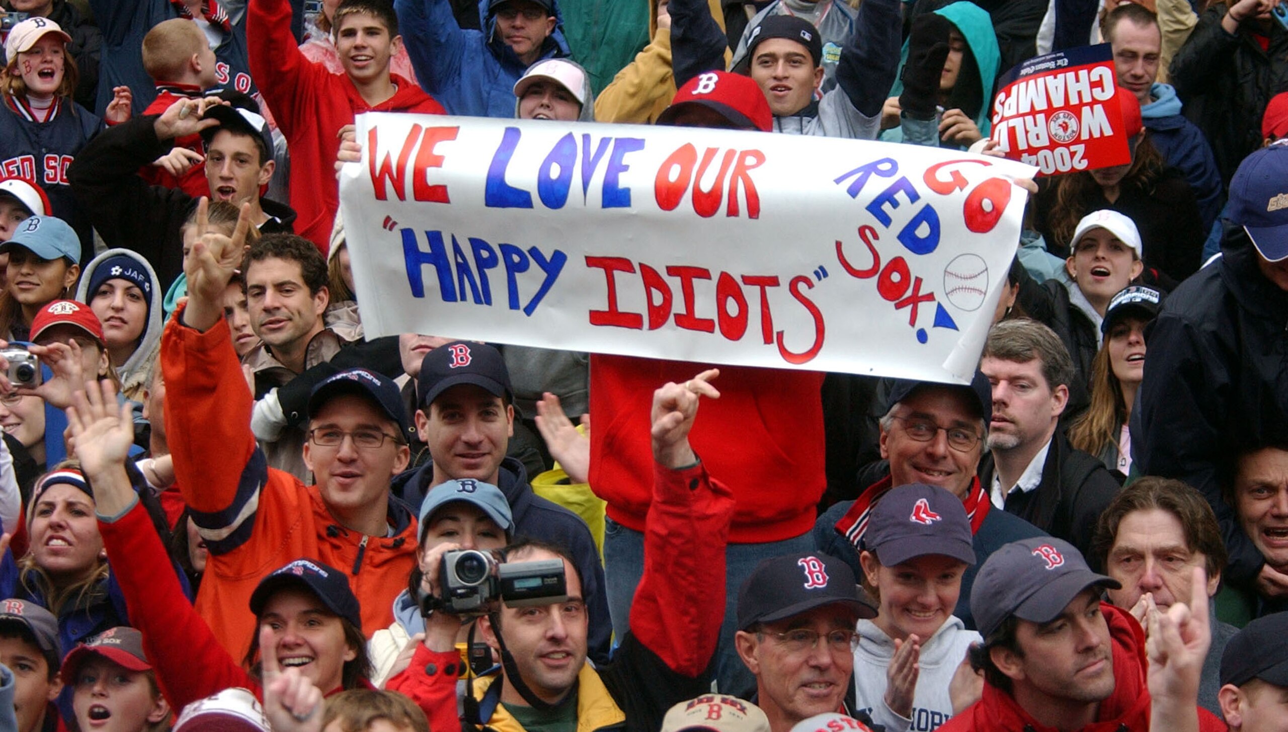 BOSTON - OCTOBER 30:  Boston Red Sox fans celebrate during a World Series victory parade October 30, 2004 in Boston, Massachusetts. The Red Sox beat the Cardinals in four straight games to take the teams first World Series since 1918.  (Photo by Darren Mc