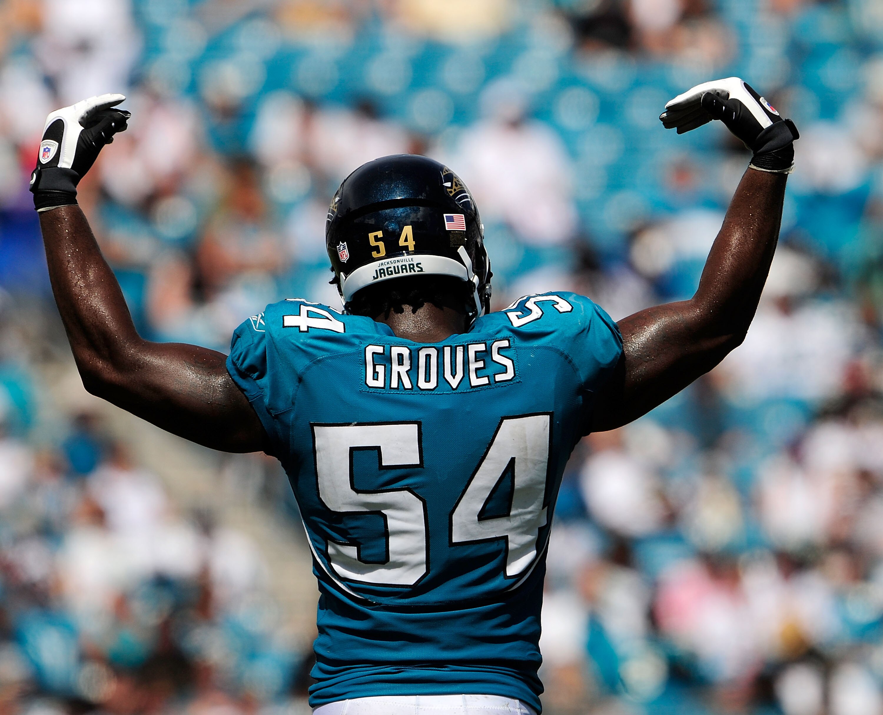 JACKSONVILLE, FL - SEPTEMBER 20:  Quentin Groves #54 of the Jacksonville Jaguars asks the crowd for noise during the game against the Arizona Cardinals at Jacksonville Municipal Stadium on September 20, 2009 in Jacksonville, Florida.  (Photo by Sam Greenw