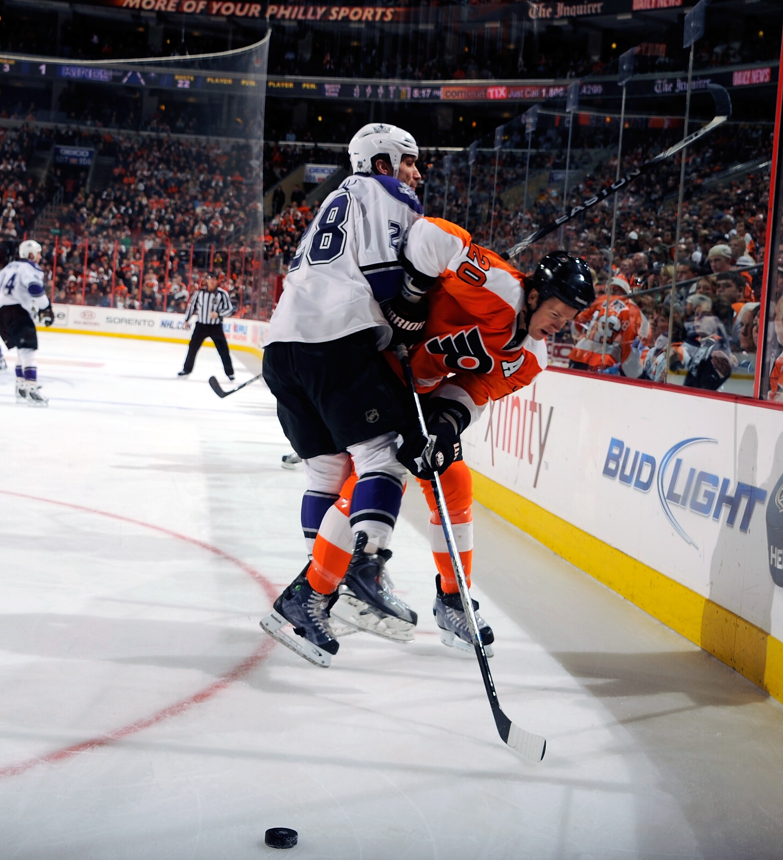 PHILADELPHIA - FEBRUARY 13:  Jarret Stoll #28 of the Los Angeles Kings checking Chris Pronger #20 of the Philadelphia Flyers on February 13, 2011 at the Wells Fargo Center in Philadelphia, Pennsylvania.  (Photo by Lou Capozzola/Getty Images)