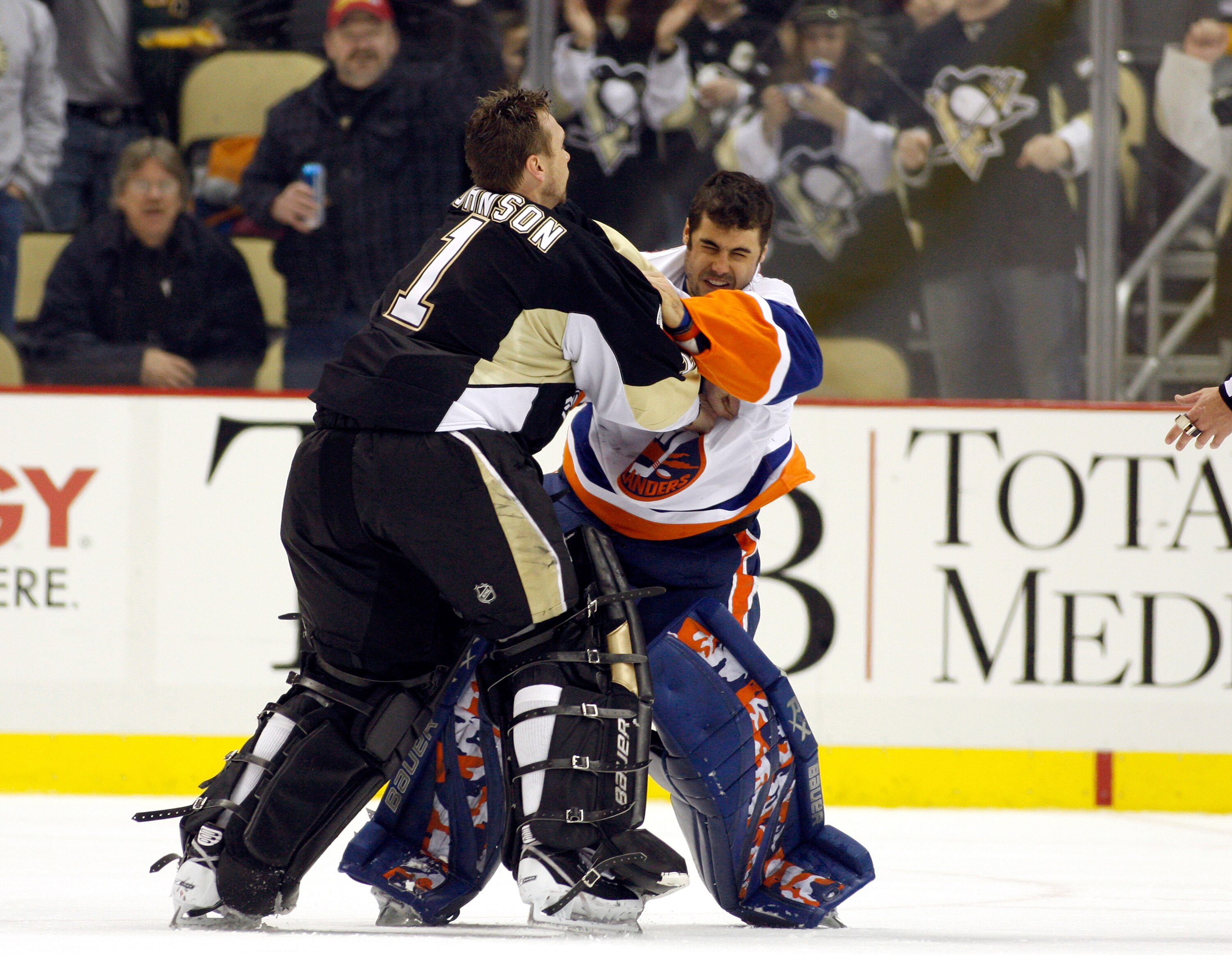 PITTSBURGH, PA - FEBRUARY 02:  Brent Johnson #1 of the Pittsburgh Penguins gets in a left against Rick DiPietro #39 of the New York Islanders at Consol Energy Center on February 2, 2011 in Pittsburgh, Pennsylvania.  The Penguins shut out the Islanders 3-0
