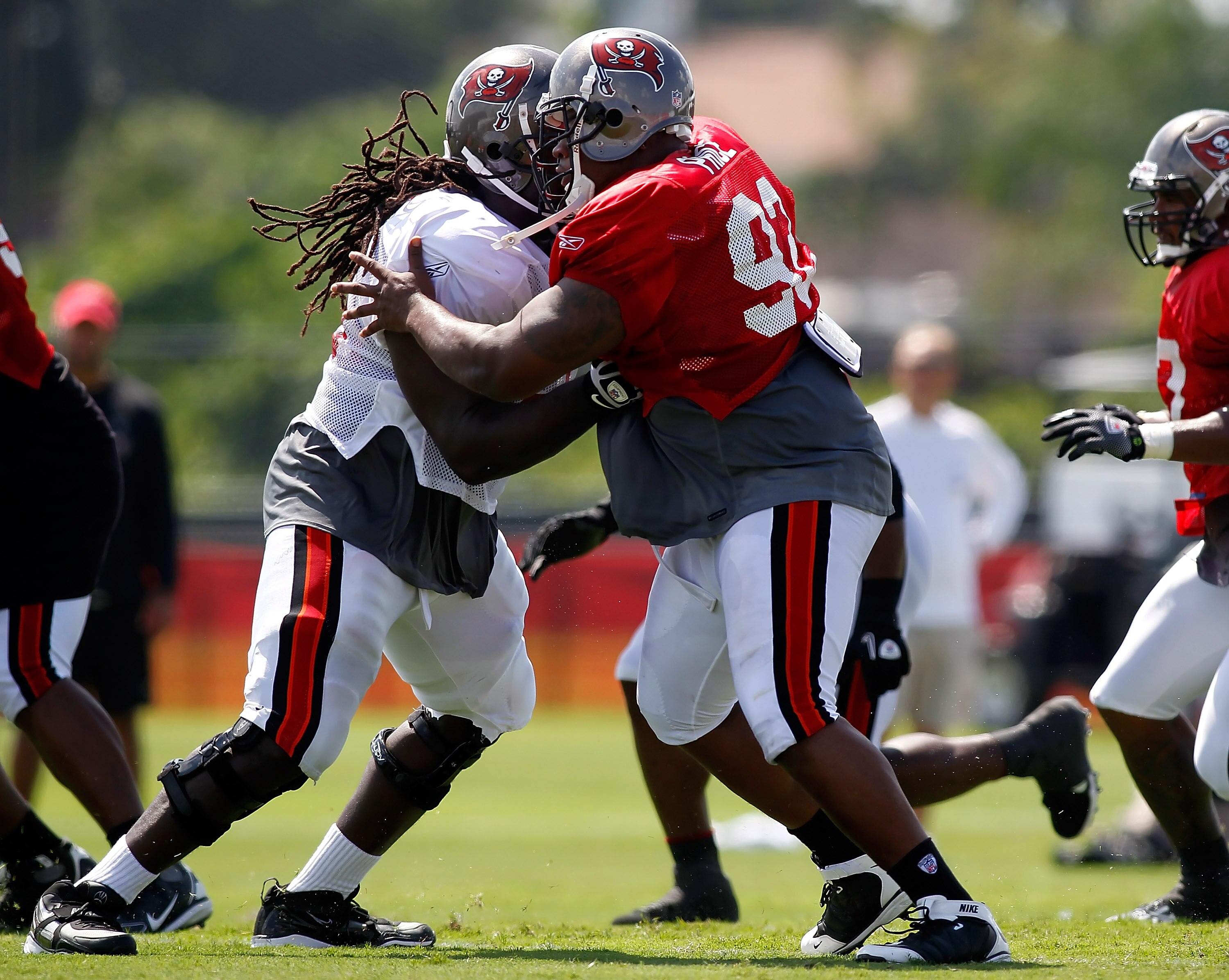 TAMPA - JULY 31:  Defensive tackle Brian Price #92 of the Tampa Bay Buccaneers works against offensive lineman Davin Joseph #75 during training camp at One Buccaneer Place on July 31, 2010 in Tampa, Florida.  (Photo by J. Meric/Getty Images)
