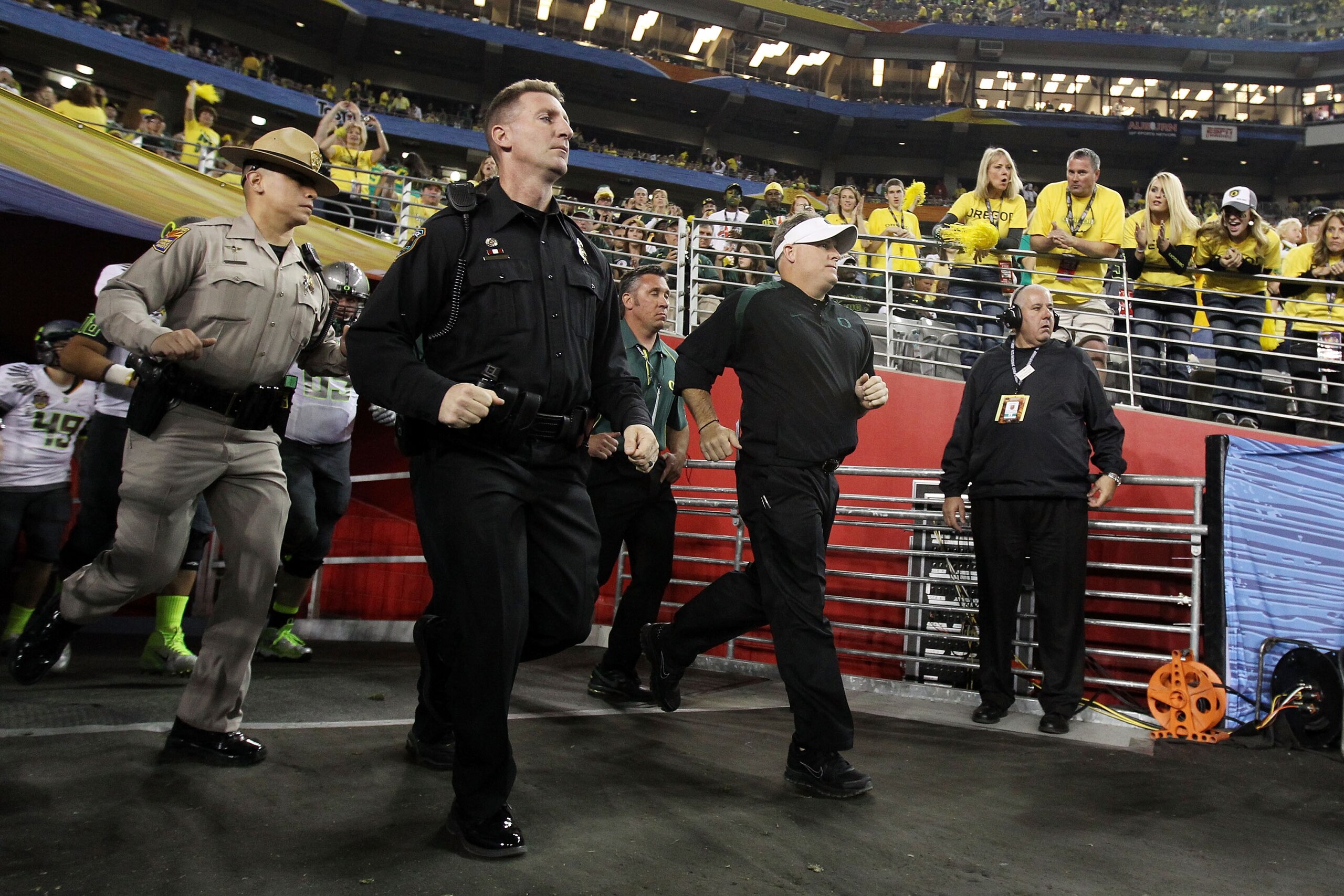 GLENDALE, AZ - JANUARY 10: Head coach Chip Kelly of the Oregon Ducks takes the field during their 22-19 loss to the Auburn Tigers during the Tostitos BCS National Championship Game at University of Phoenix Stadium on January 10, 2011 in Glendale, Arizona GLENDALE, AZ - JANUARY 10: Head coach Chip Kelly of the Oregon Ducks takes the field during their 22-19 loss to the Auburn Tigers during the Tostitos BCS National Championship Game at University of Phoenix Stadium on January 10, 2011 in Glendale, Arizona