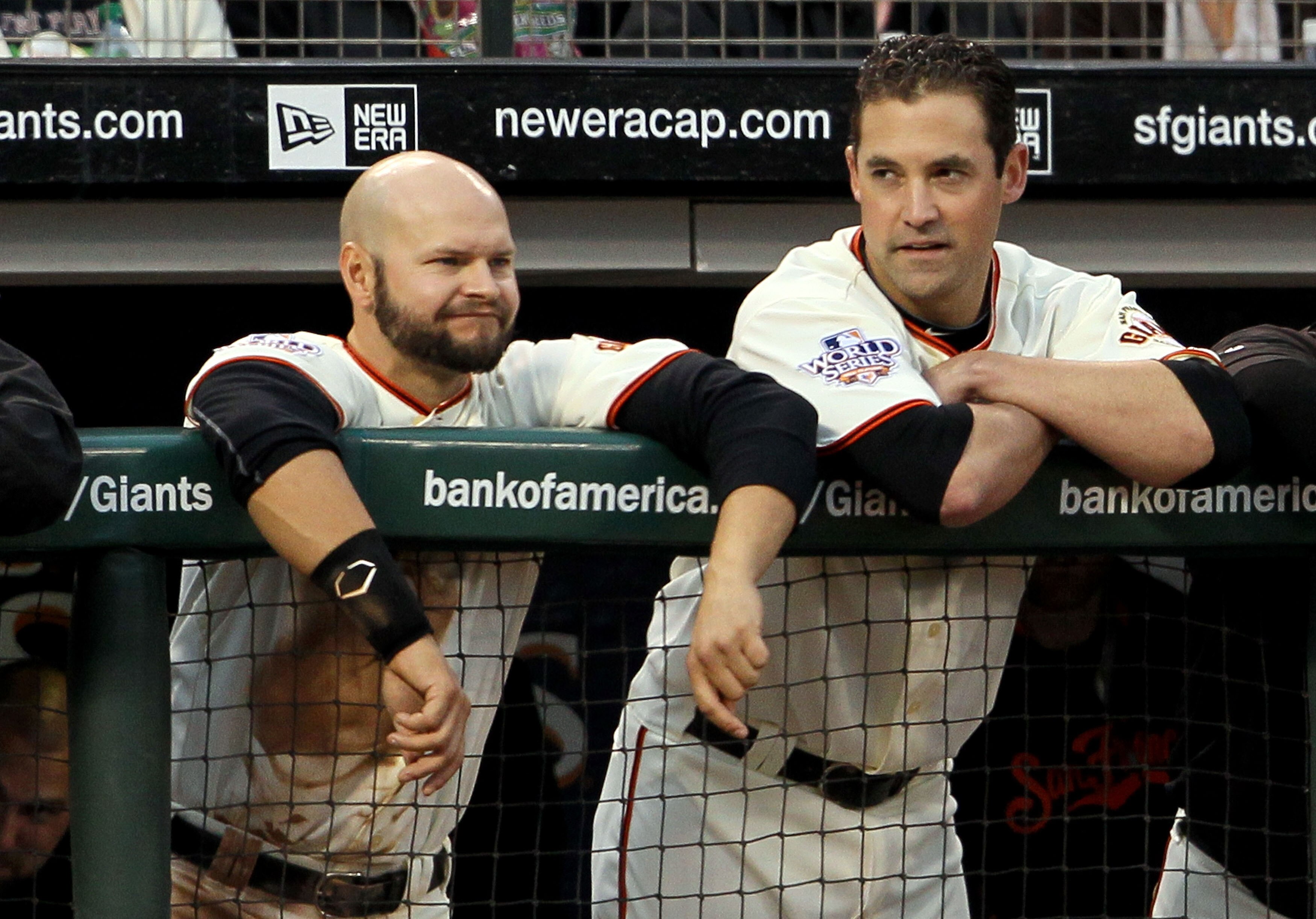 SAN FRANCISCO - OCTOBER 28:  (L-R) Cody Ross #13 and Pat Burrell #9 of the San Francisco Giants lean on the dugout fence while taking on the Texas Rangers in Game Two of the 2010 MLB World Series at AT&T Park on October 28, 2010 in San Francisco, Californ